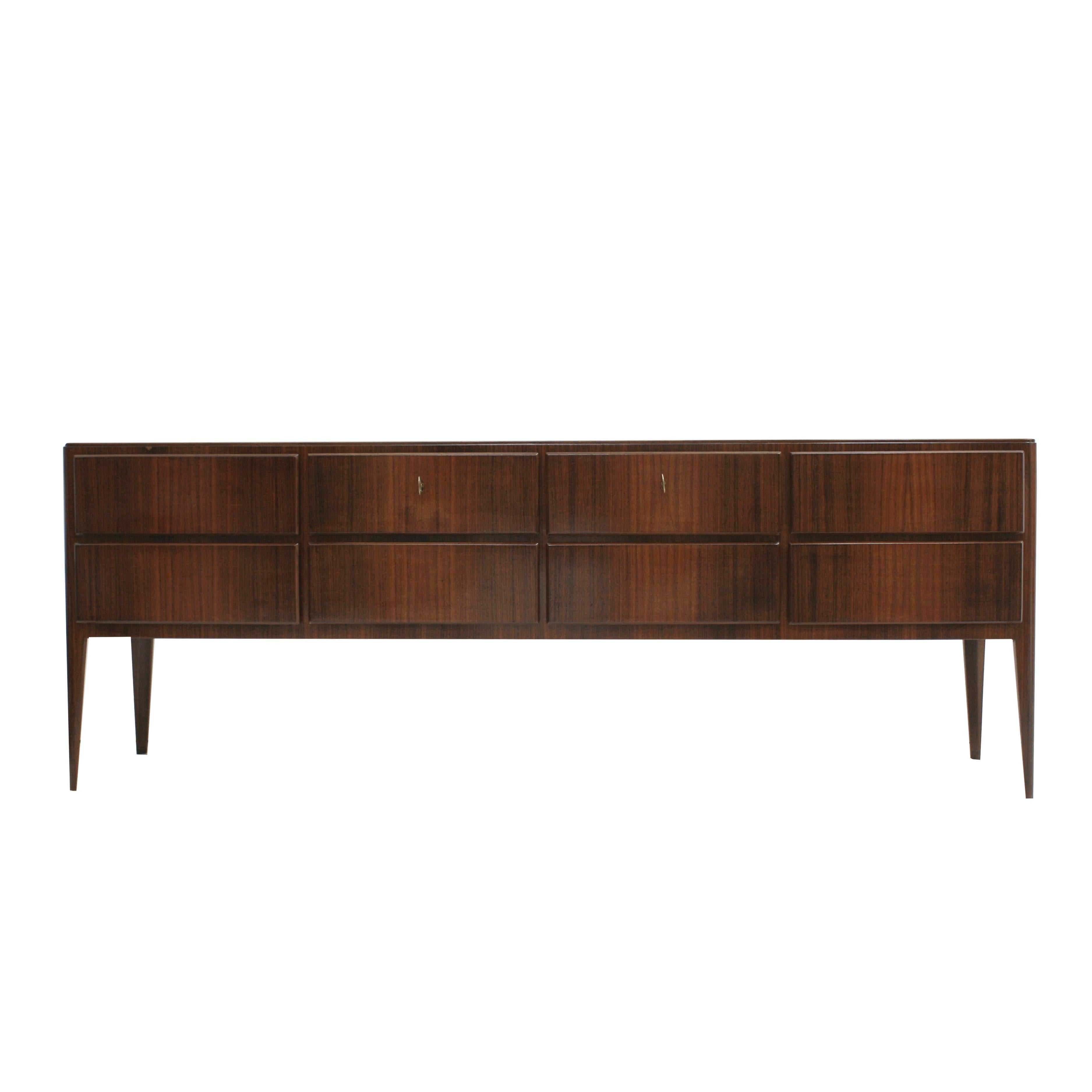 1950s Italian sideboard composed of eight drawers and four legs made of solid wood structure covered in rosewood and rose onyx marble-top.

Our main target is customer satisfaction, so we include in the price for this item professional and