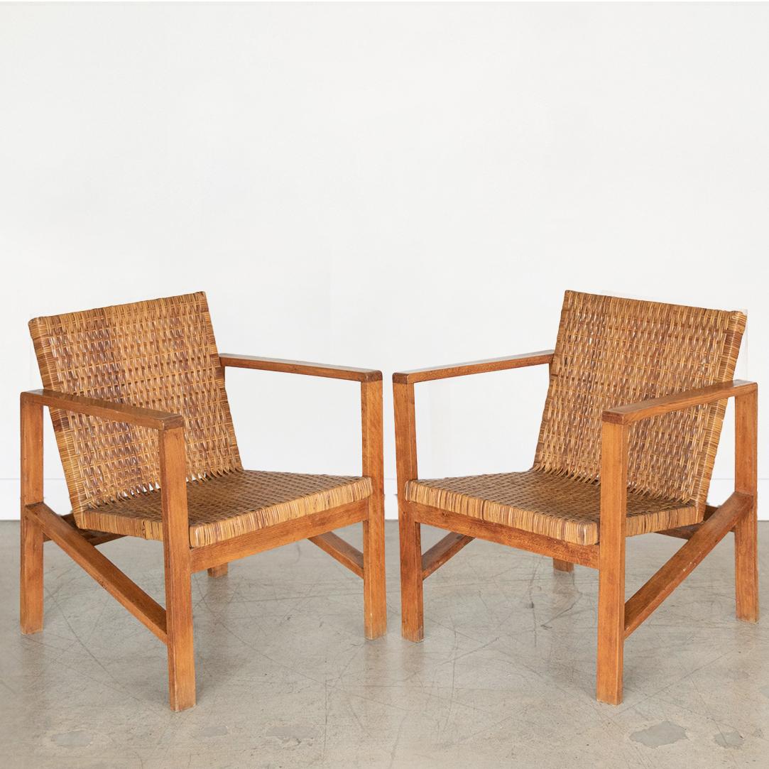 Incredible pair of wood armchairs with woven seats from Italy, 1950's. Square wood frame and woven rattan seats with original finish and nice patina.