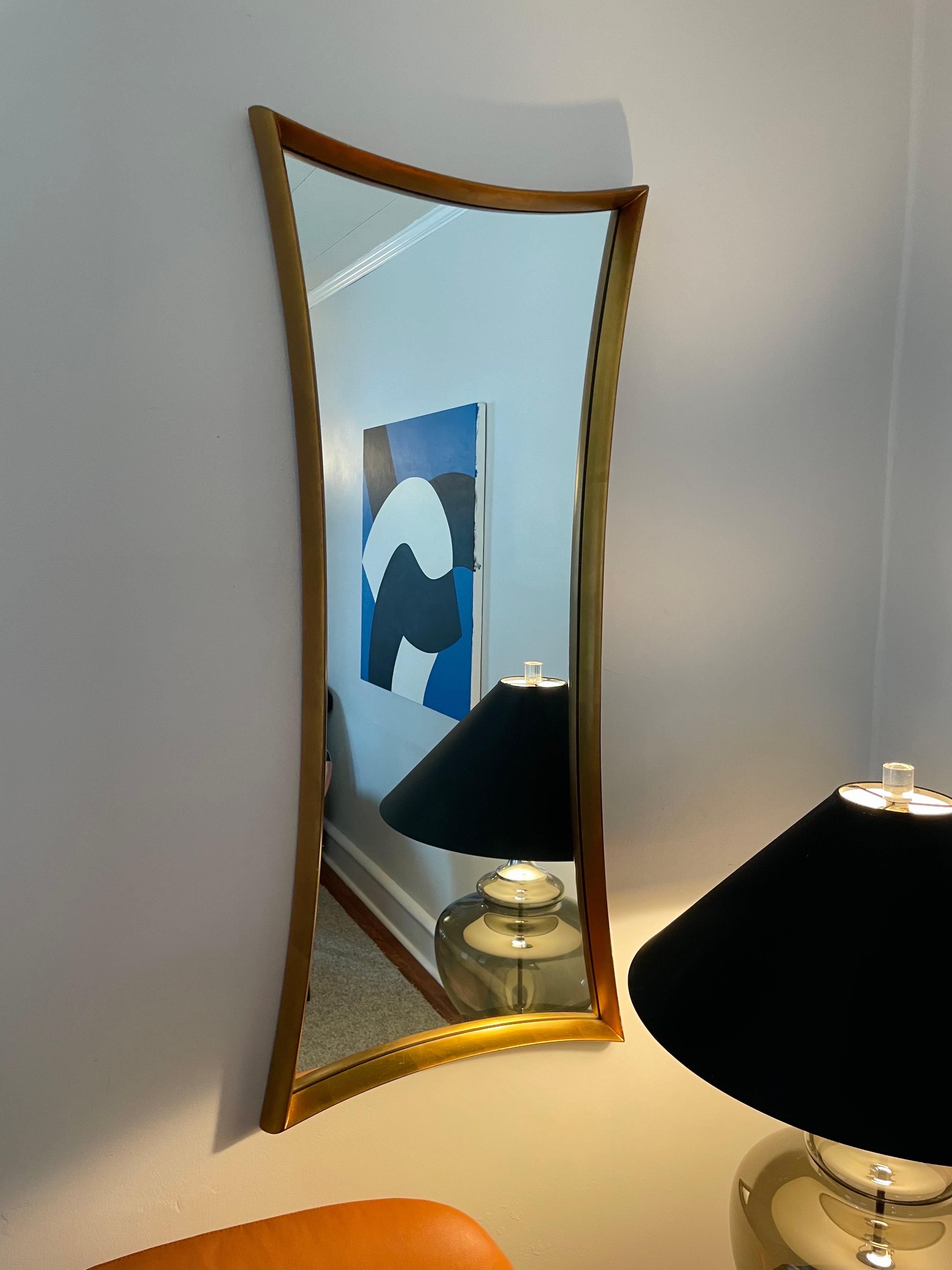 This is a large Giltwood bow-tie mirror from the 1950s.

It is in excellent shape, having been unmoved from its initial hanging spot for several decades.

