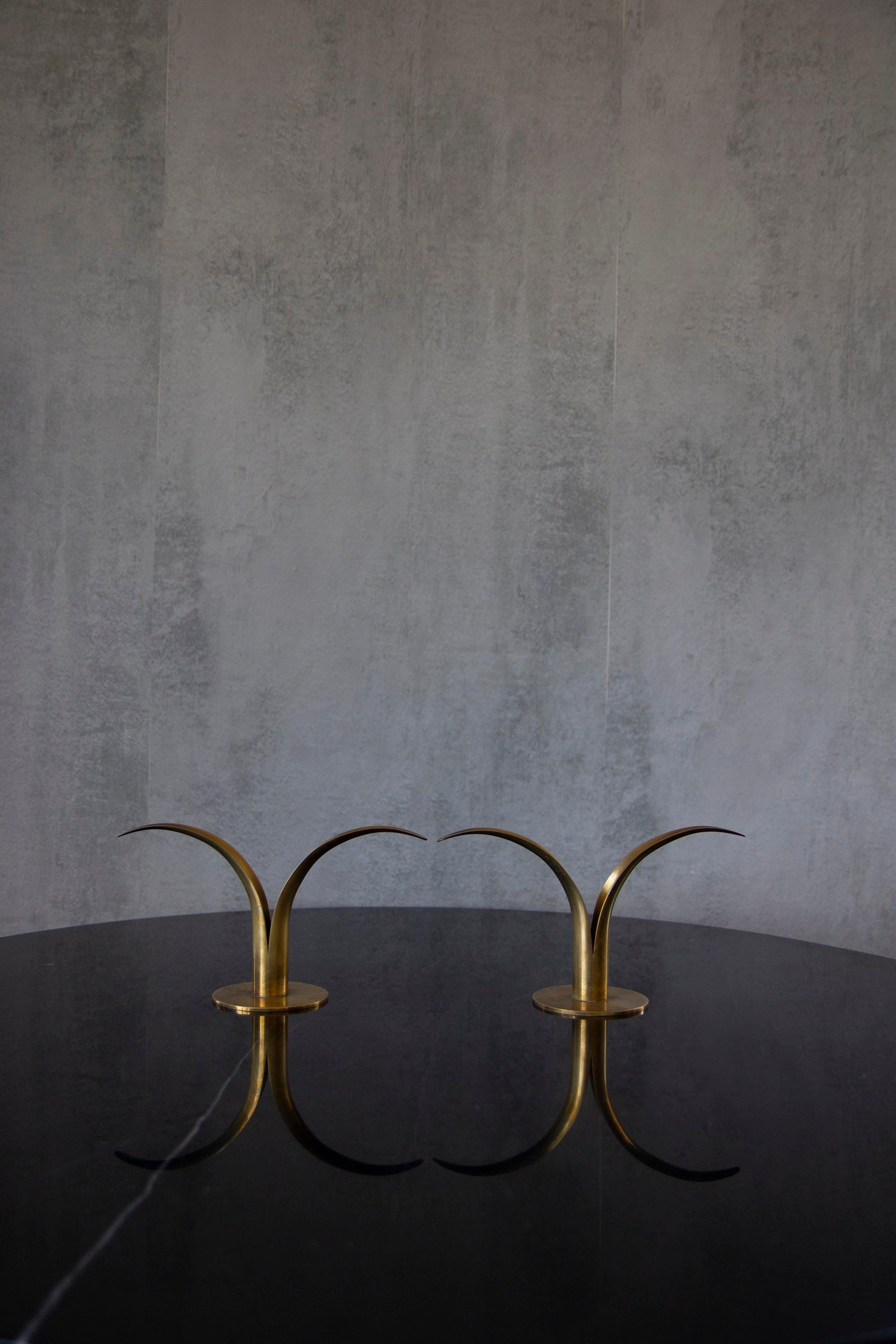 Pair of organic candlesticks/candleholders, designed by Ivar Åhlenius Björk for Ystad Metall. Made of brass and lacquered steel. Stamped.