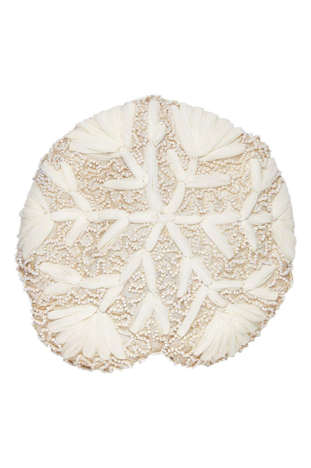 This enchanting 1950s ivory bridal cap is beautifully constructed and labeled Ja -Lee of New York. The soft ivory silk overlay is embroidered with a soft mesh thread in a paler tone to create the shape of a snowflake which covers the entirety of the