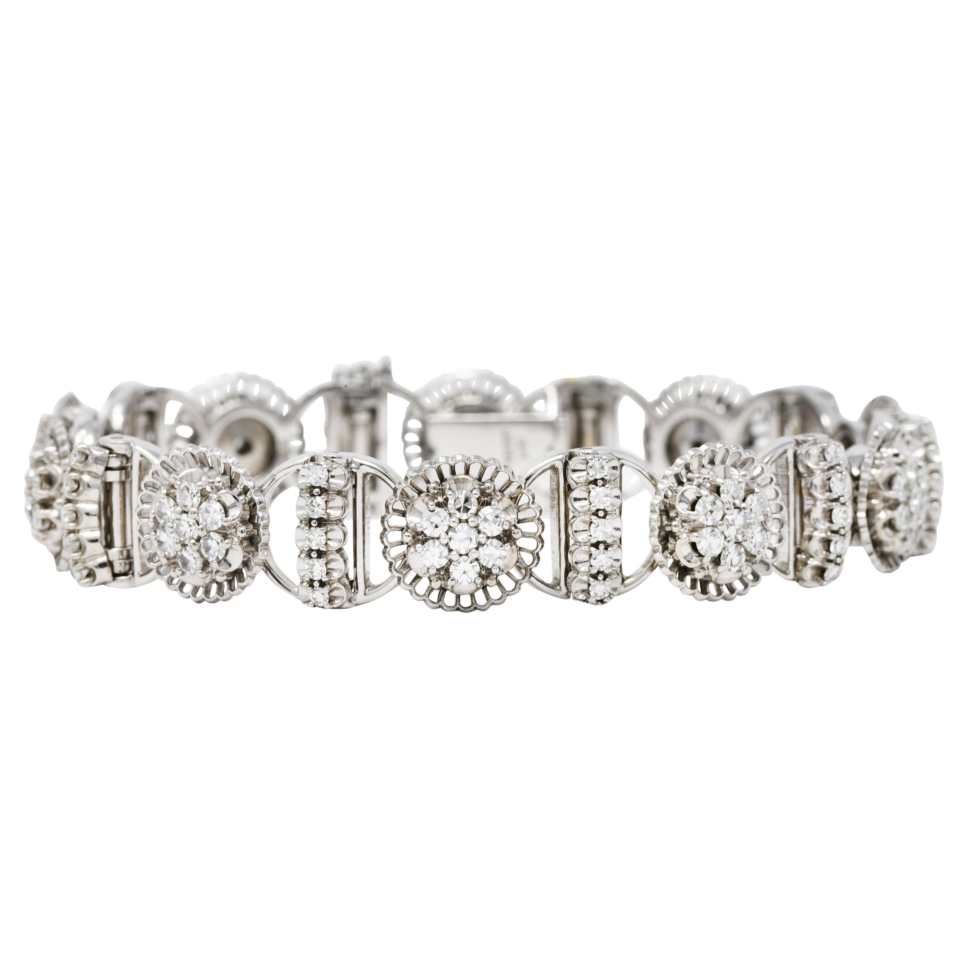 Bracelet has circular cluster links with a frilled scallop surround alternating with bar links

Belcher set throughout by single cut diamonds weighing in total approximately 3.00 carats

Very well matched with G to I color and VS clarity

Completed
