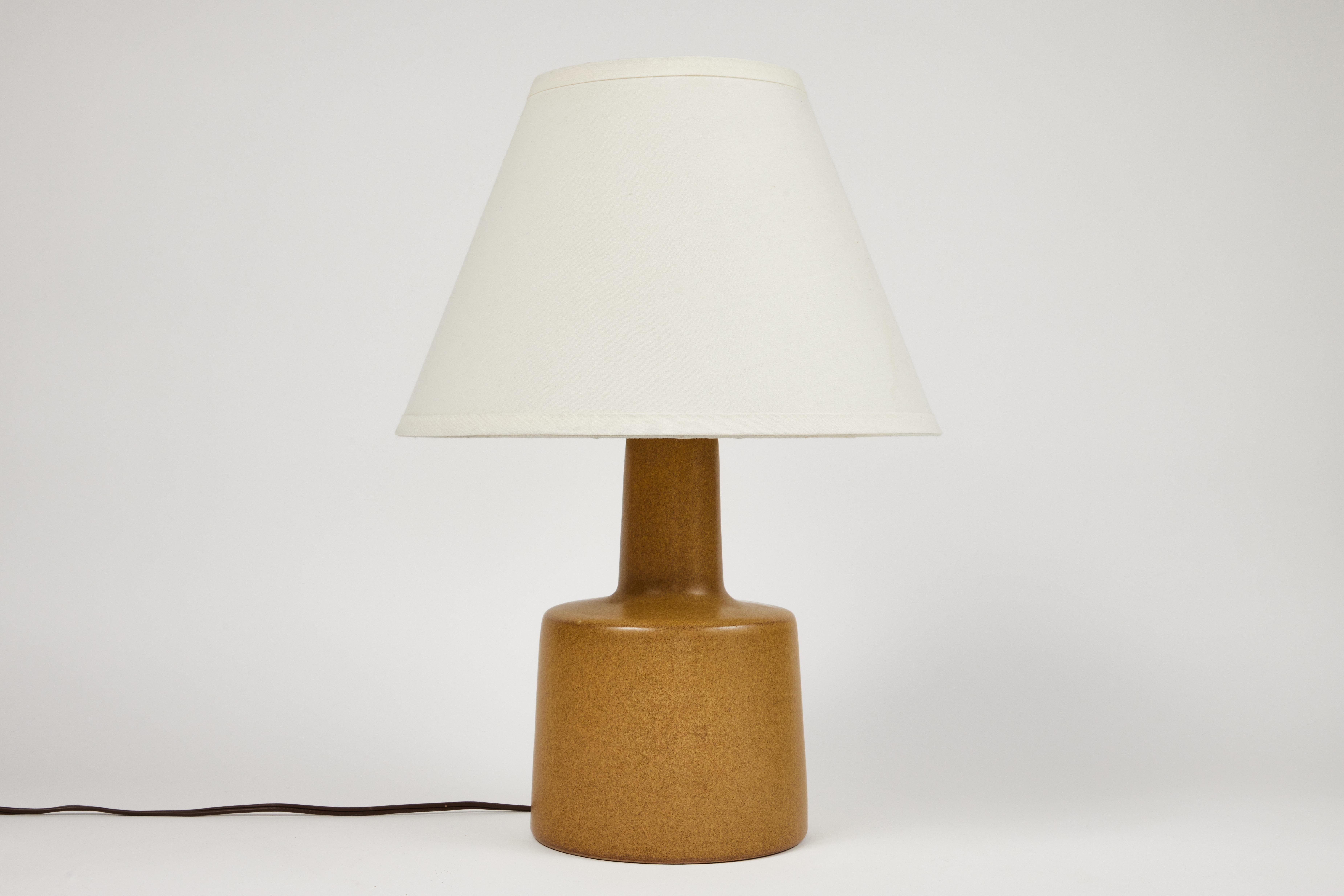 1950s Jane & Gordon Martz table lamp for Marshal Studios. Executed in ceramic with newer shades. Produced by Marshall Studios, Indianapolis, circa 1950s. An iconic example of midcentury Americana at its most refined. Signature in ceramic and both