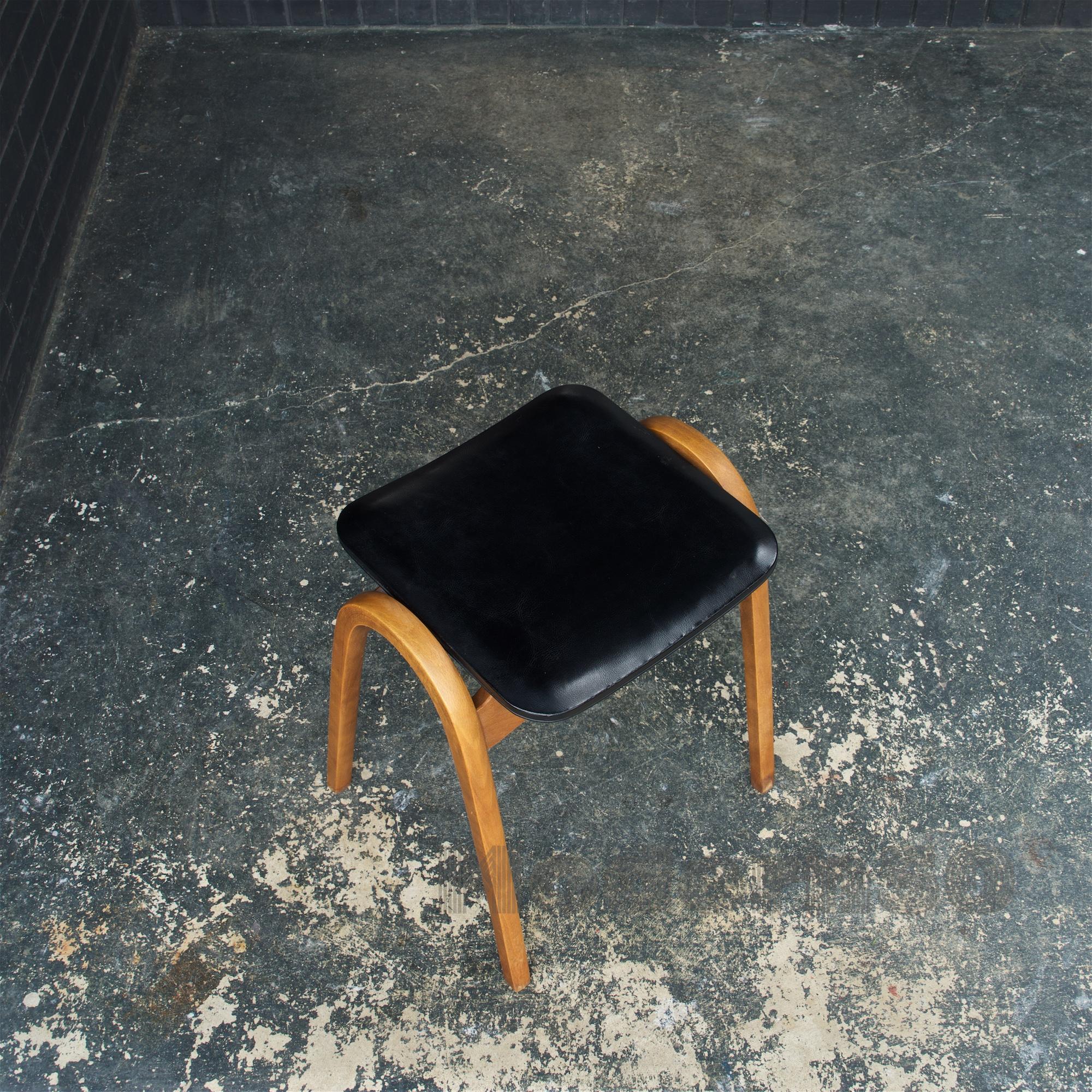 All original and retaining its original vinyl upholstery.  A wonderful japanese bentwood stool by Isamu Kenmochi for Akita Mokko of Japan, c.1950s. Made of stained beech, and black vinyl.