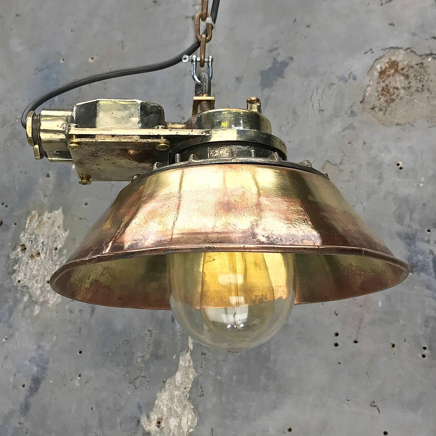 Becoming more sought after and not often seen, these reclaimed original 1950's flush mount lamps have been expertly modified to pendant lights.

The main body of the light is made from cast brass, with a machine pressed conical brass shade, and