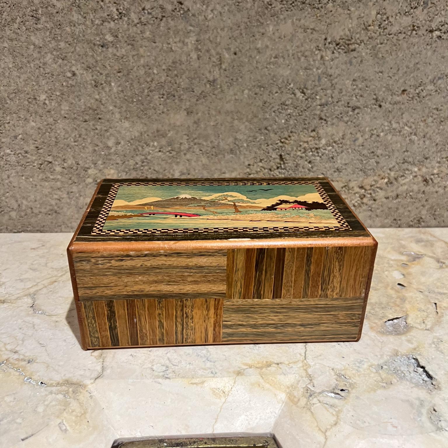 AMBIANIC presents
1950s Japanese Scenic Mountains Secret Puzzle Trick Box Wood Inlay #3
3 h x 7 w x 4.5 d
Original vintage, refer to images.