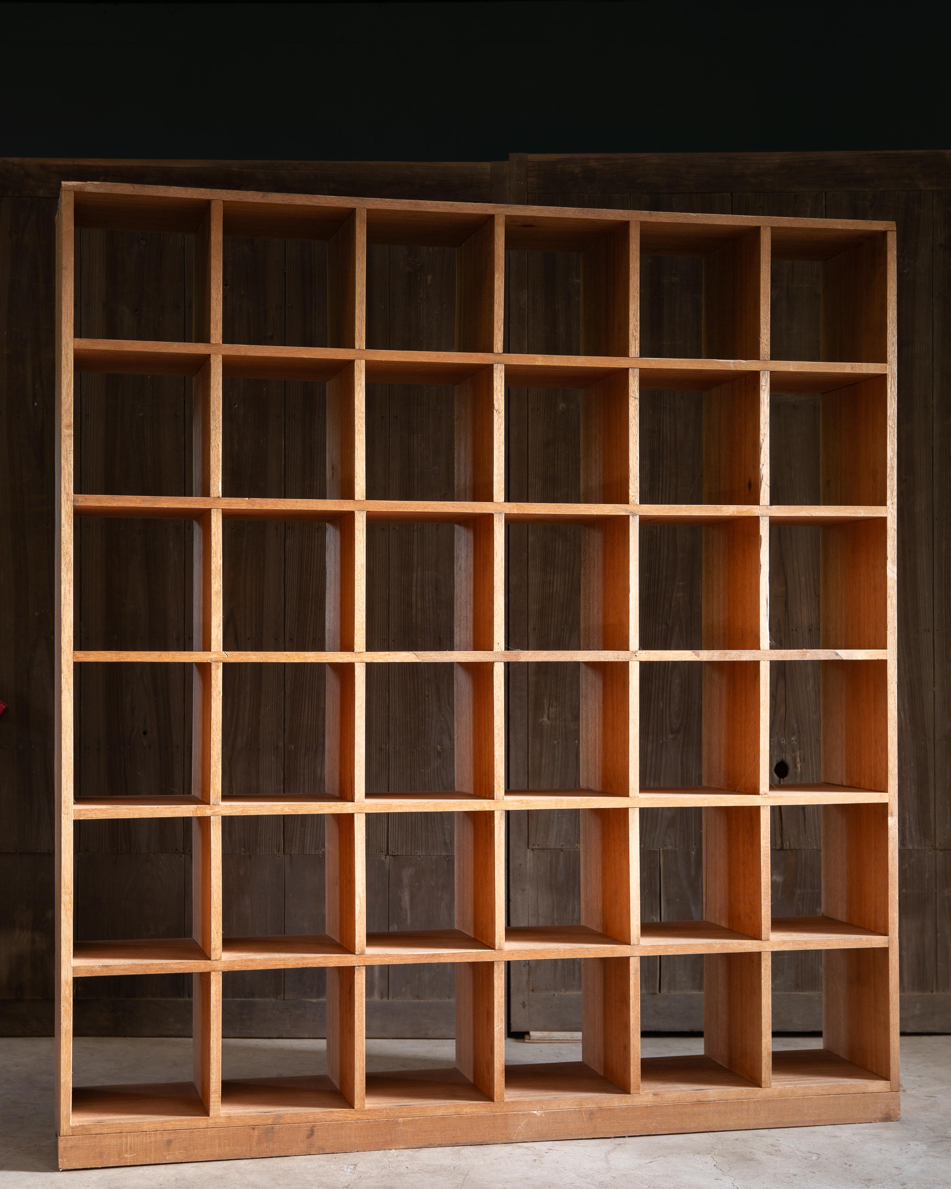 This vintage, 6.15 feet (187.5cm) tall, 5.61 feet (171cm) wide open back square shelving unit was manufactured in circa 1950s to 70s, estimate from the style & material. Fully made of solid meranti wood (also called Lauan / Philippine