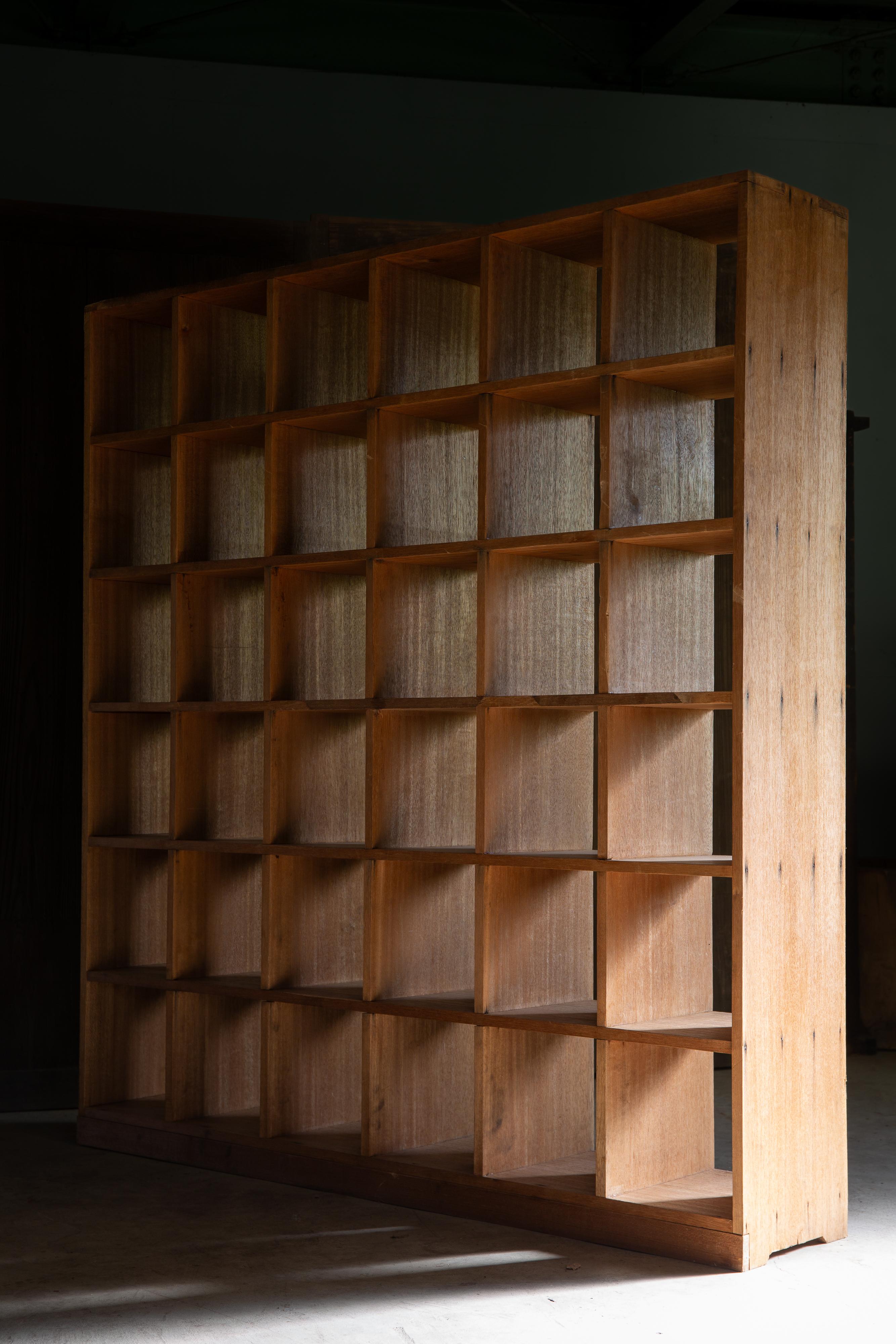 This vintage, 6.15 feet (187.5cm) tall, 5.61 feet (171cm) wide open back square shelving unit was manufactured in circa 1950s to 70s, estimate from the style & material. Fully made of solid meranti wood (also called Lauan / Philippine