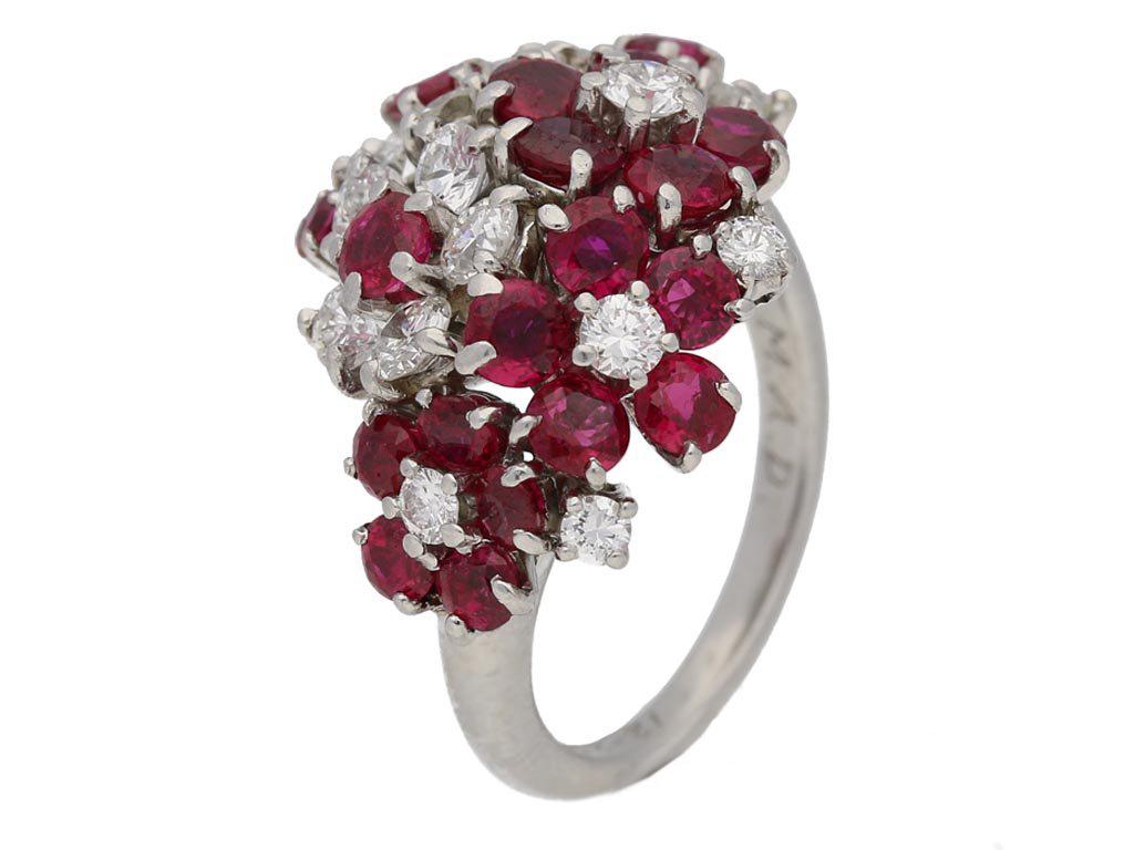 Ruby and diamond ring by J.E.Caldwell & Co. Set with twenty round old cut natural unenhanced Burmese rubies in open back claw settings with a combined approximate weight of 2.00 carats, combined with twenty round brilliant cut diamonds in similar