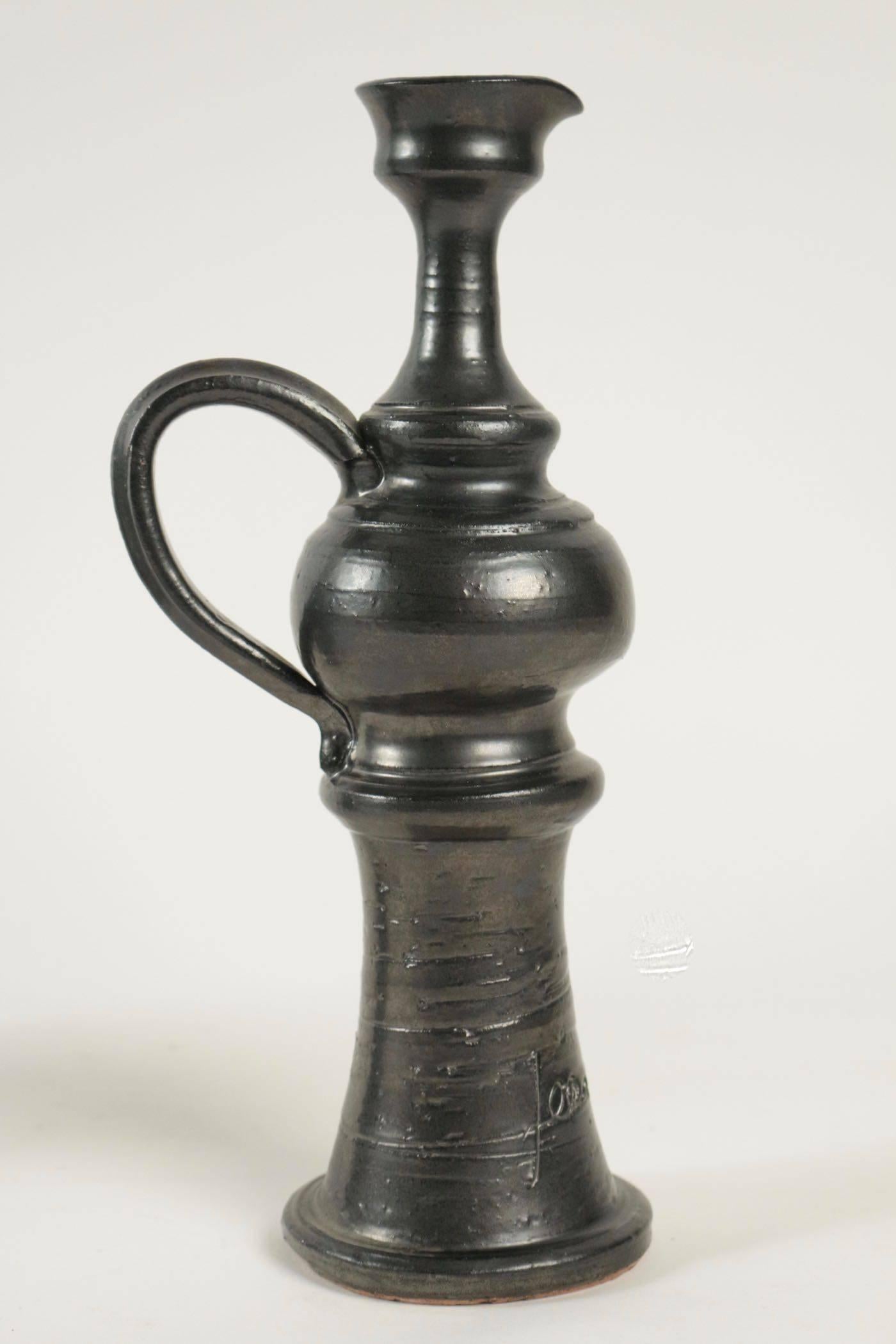 1950s Jean Marais bud vase.

Made of black enameled ceramic.

Engraved signature: Jean Marais.