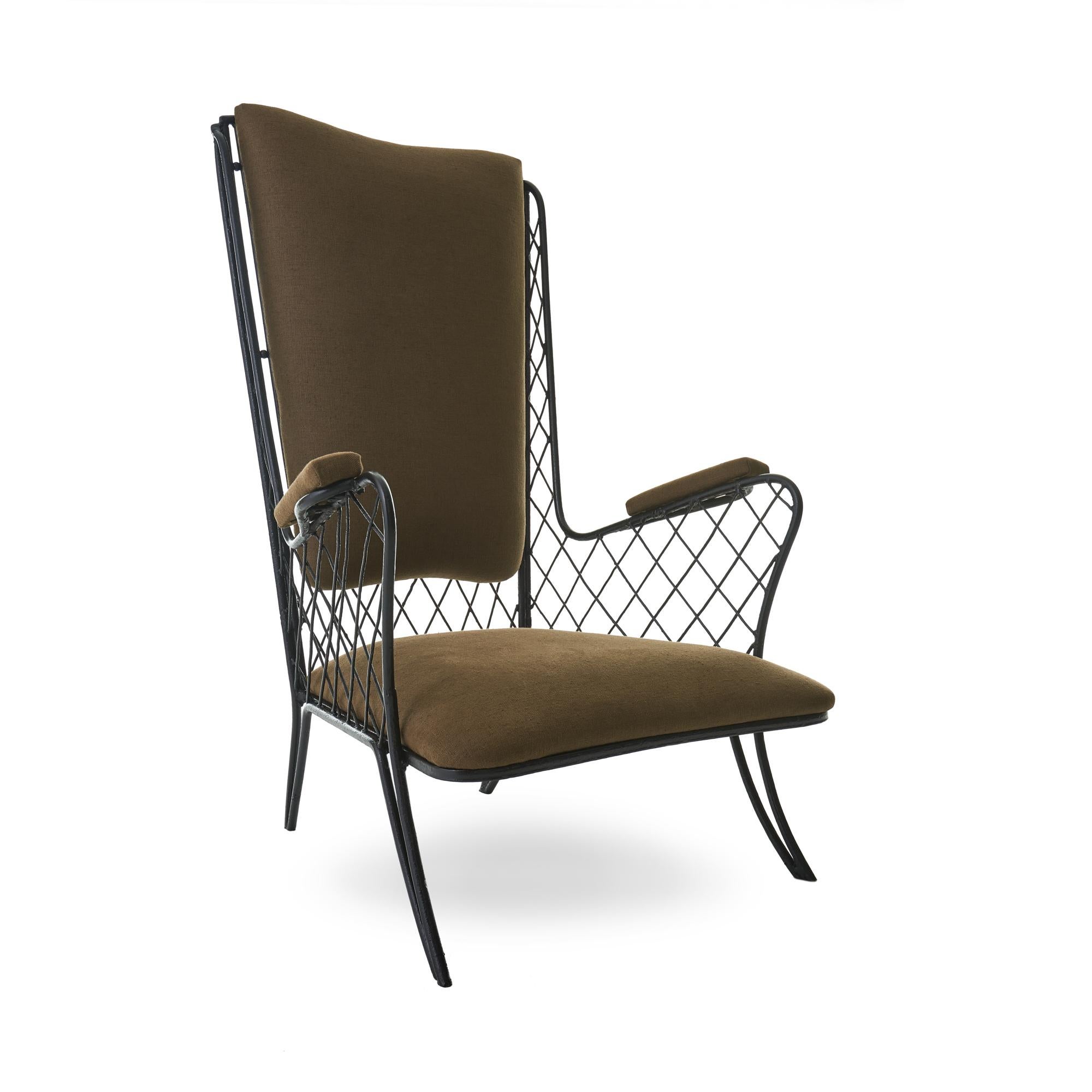 Elegant 1950s pair of low slung armchairs attributed to Jean Royère. Delicate iron latticework has been repaired and repainted, reupholstered with an earthen brown linen. 

Measures: 25” D x 27” W x 40.5” H, 12” seat height.
