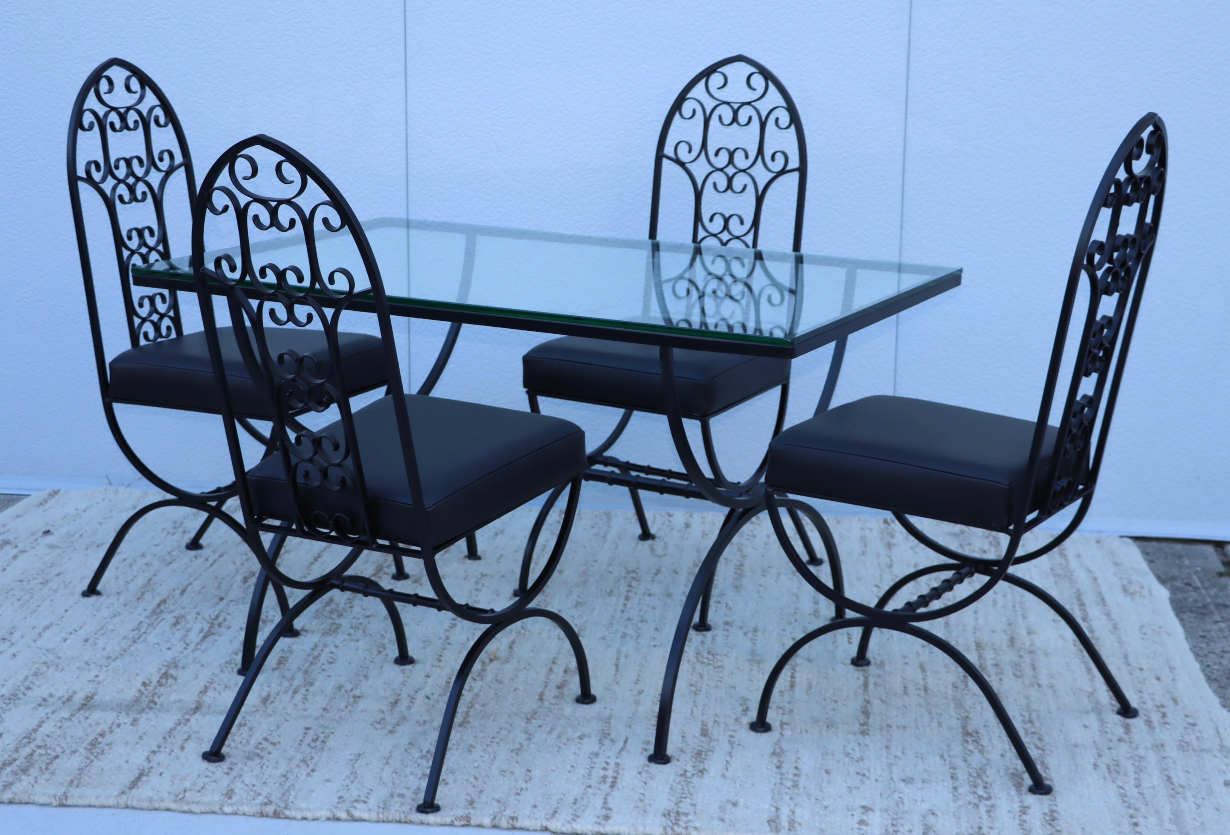 1950's Mid-Century Modern wrought iron dining set by John Salterini, newly painted with new glass top and new leather upholstery seats.