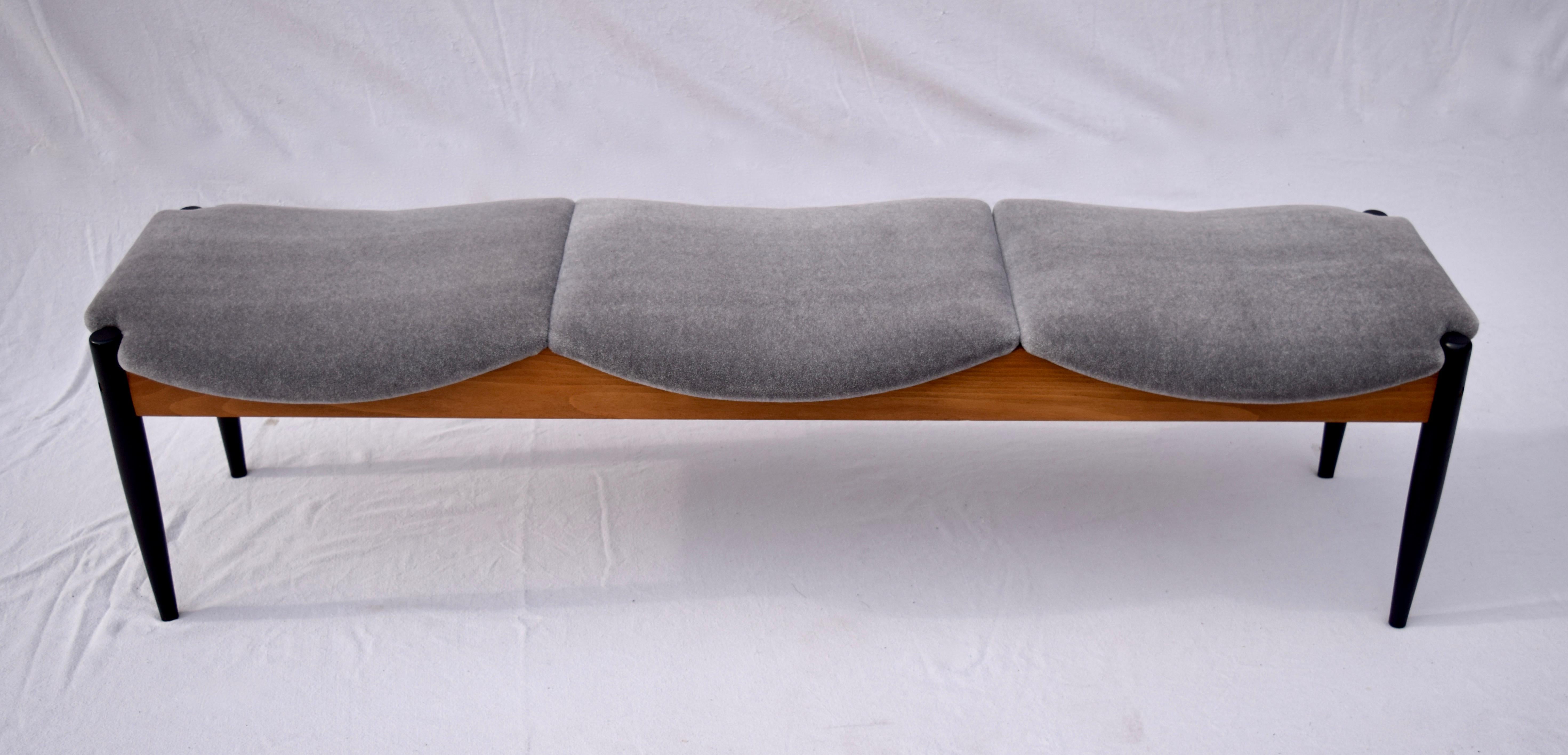 Desirable Midcentury three seat bench by John Stuart of walnut structure with beautifully maintained original finish. Newly re-upholstered in plush grey Mohair.