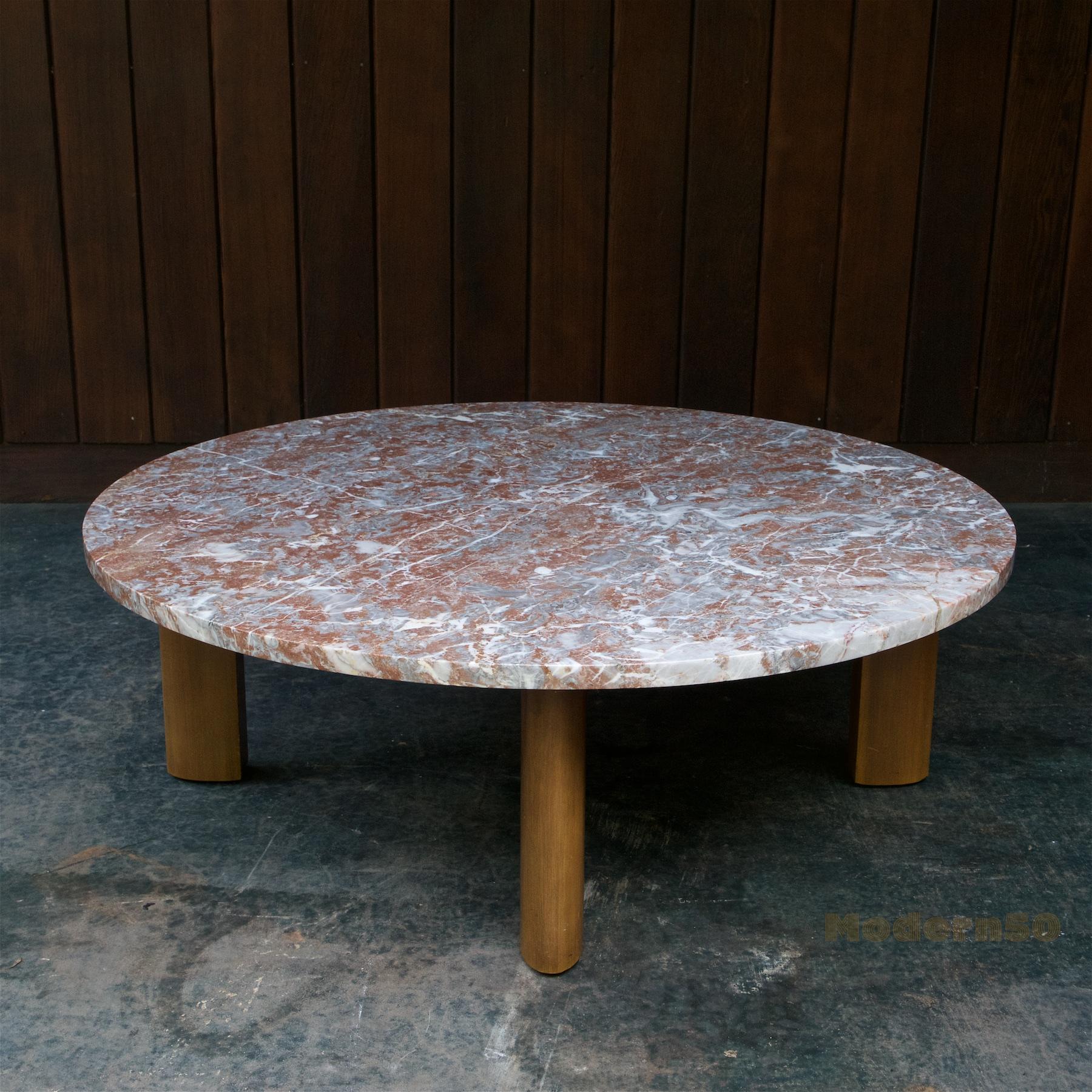 Heavy warm red veined flat-edged round circular marble slab, mahogany sculptural leg base. Photographed outside in natural light, so will appear darker indoors.