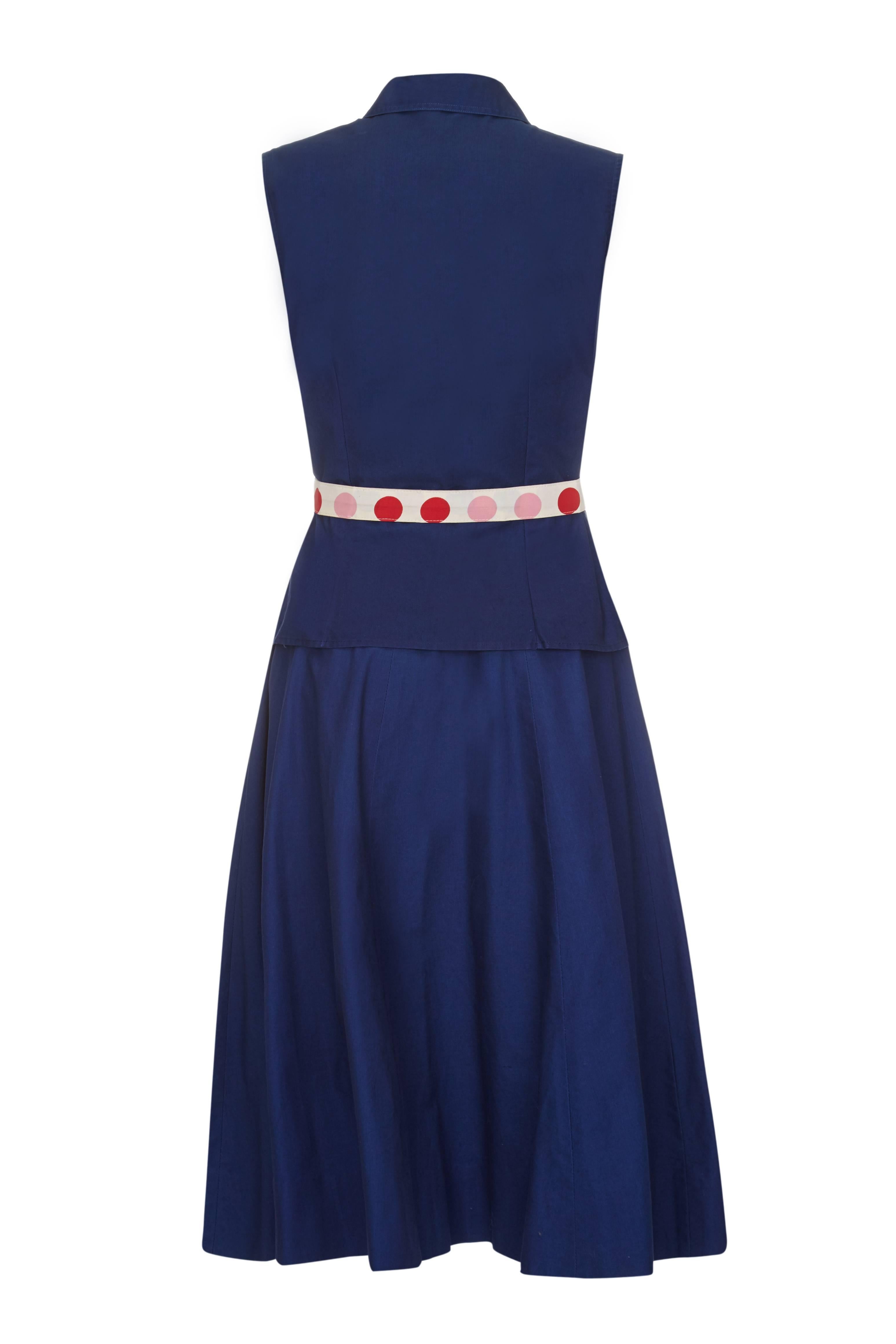 This charming 1950s navy blue cotton two piece skirt set is from popular American ready to wear designer Jonathan Logan and is in super vintage condition with some quirky details. The set is comprised of a sleeveless top and full ankle length skirt