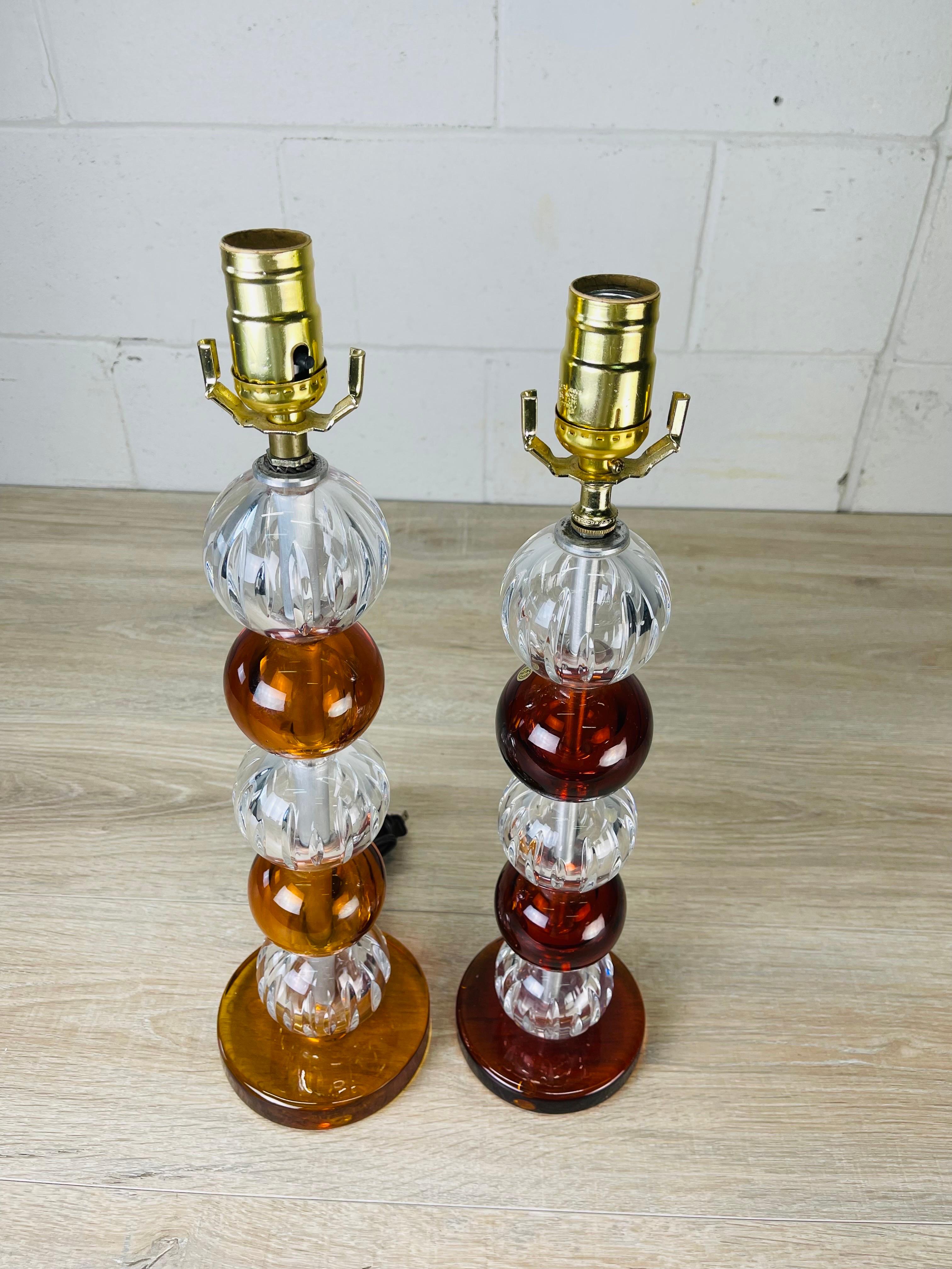 Vintage 1950s pair of Karl Fagerlund for Orrefors stacked multi-colored glass ball table lamps. Wired for the US and in working condition. Uses standard 100W bulbs. These were originally purchased in Denmark and the wiring has been converted. One