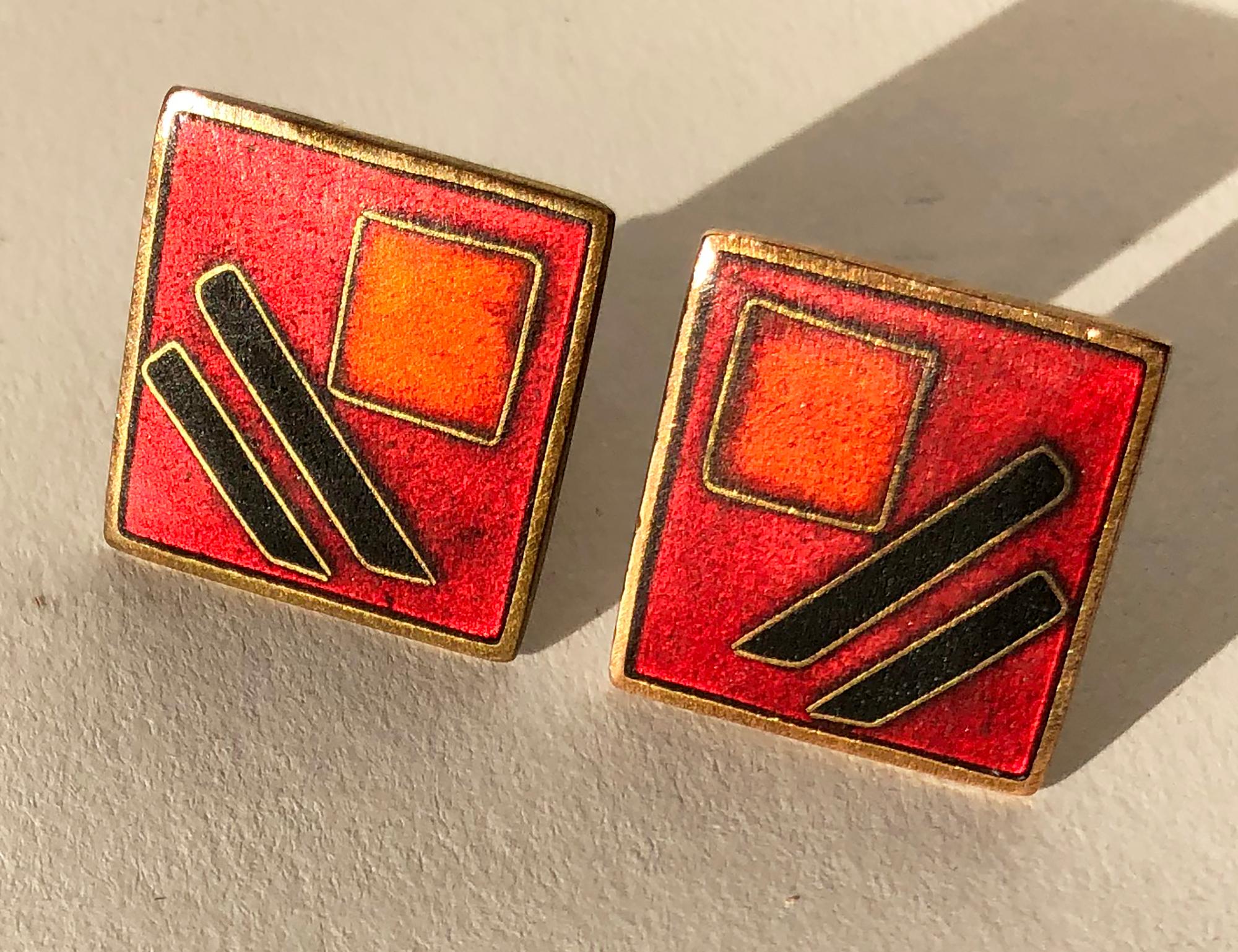 Pair of German modernist brass and enamel cufflinks designed by Karl Schibensky or Scholtz and Lammel, circa 1950s.  Dark red cufflinks measure .75