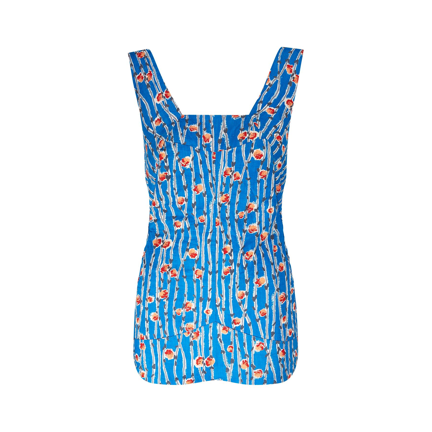 Original late 1950s or very early 1960s smocked one-piece swimsuit made from cotton in an azure blue with a stylised trellis rose and rose stem print. The swimsuit has wide straps and a square neckline with a beautifully shaped and paneled torso. 