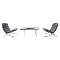1950's Knoll International Pair of Barcelona Chairs and Glass Top Coffee Table