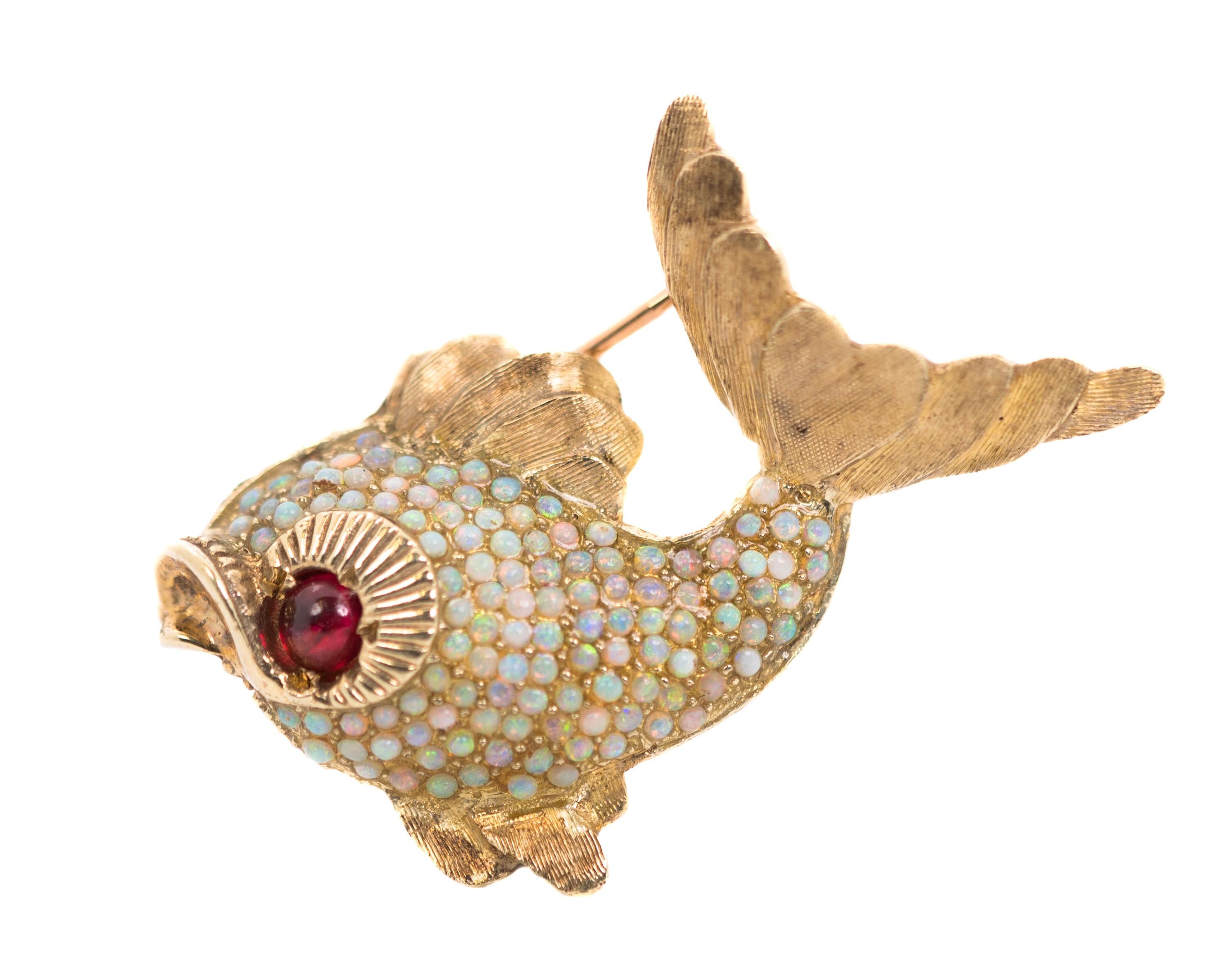 1950s Retro Koi Fish Brooch - 18k Yellow Gold, Garnet, Opals

Features:
Rich 18 Karat Yellow Gold
Garnet cabochon eye
Opal scales with Rainbow color play
Matte textured gold tail and fins
high polish Nautilus textured eye socket which flows into the