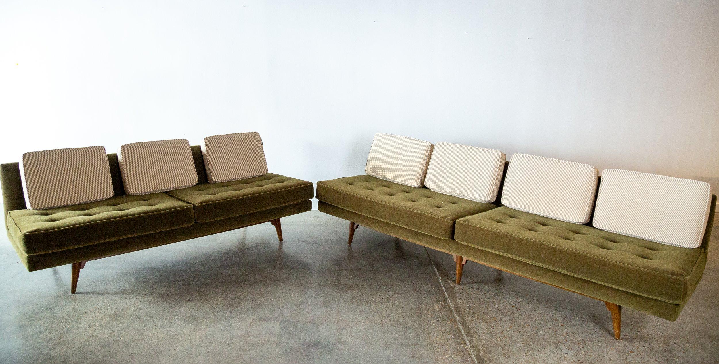 A pair of 1950s iconic armless sofas designed by Edward Wormley for Dunbar Furniture model 5526.  As a pair they form a nice L shape sectional.  Reupholstered in a green mohair base with neutral diagonal striped wool loose cushions.  A very airy