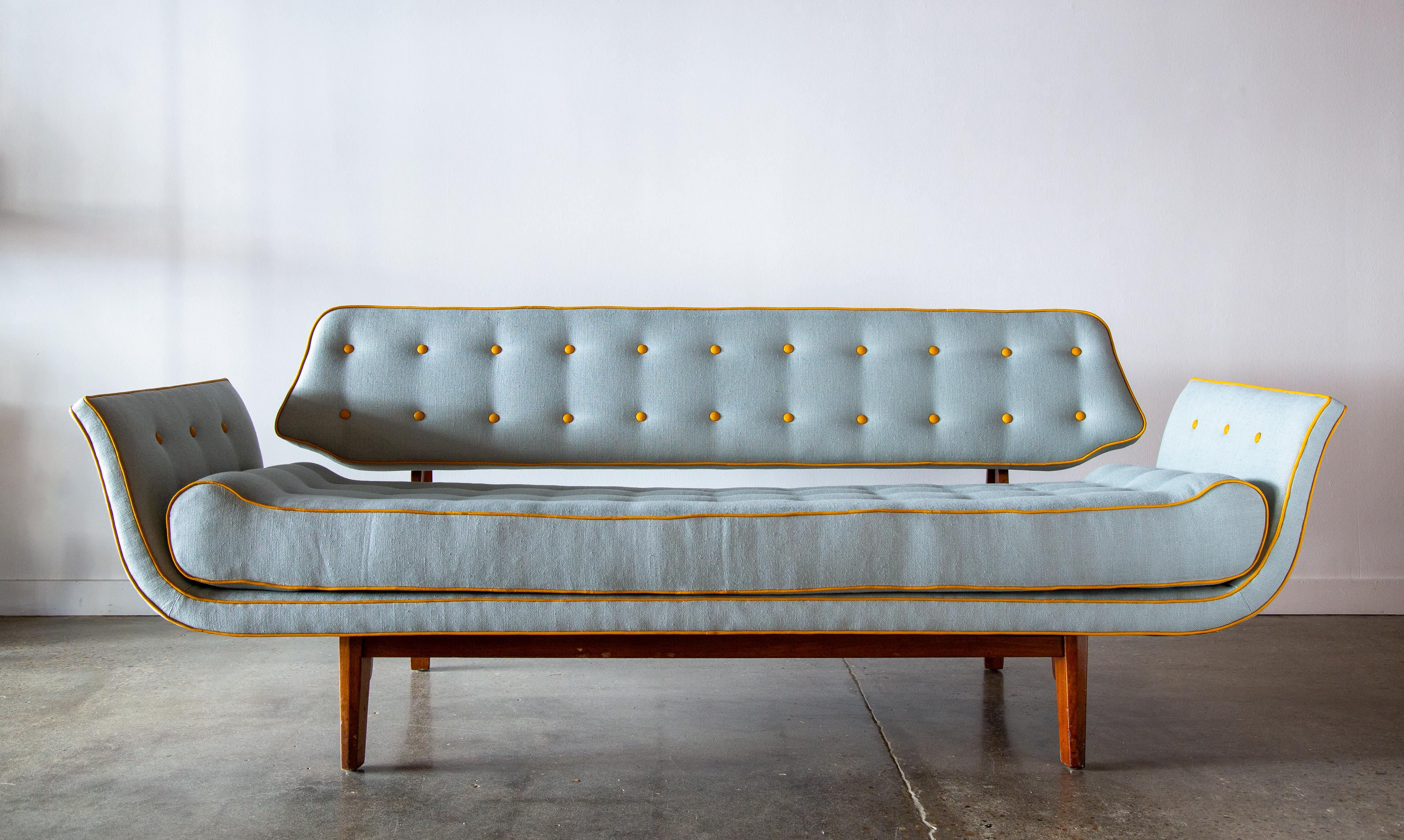 A 1950s La Gondola Sofa designed by Edward Wormley for Dunbar. This sofa with a solid mahogany bracket back, exaggerated curved arms, and floating open back is a true masterwork. The cushion with raised ends to mimic the shape of the back, is