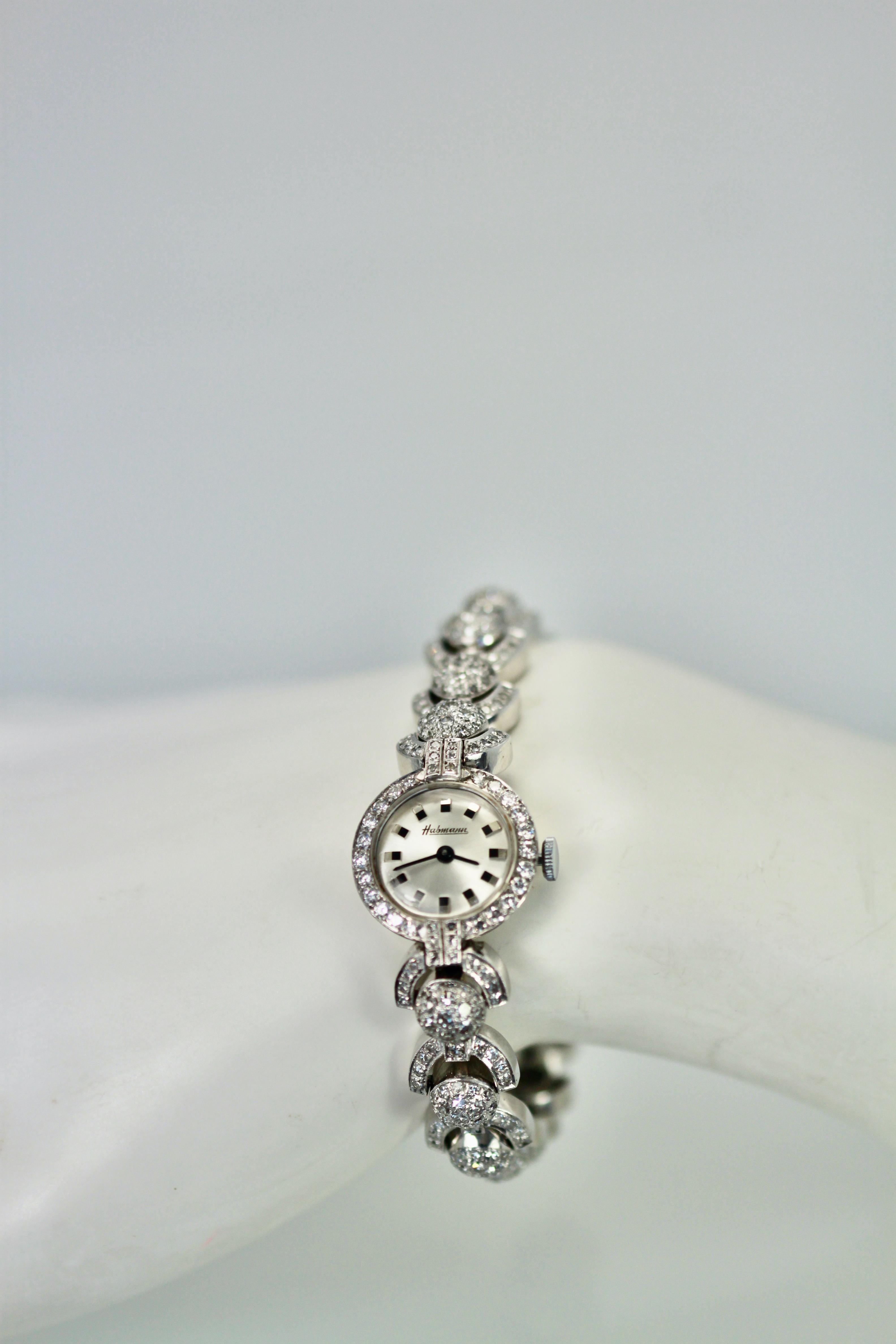 The 1950's brought us jeweled and Diamond watches that looked like bracelets. This Diamond Cocktail watch is very unique as the bracelet is 3 dimensional and just gorgeous.
This is done in a ball and loop design totaling 4.2 carats in mostly single