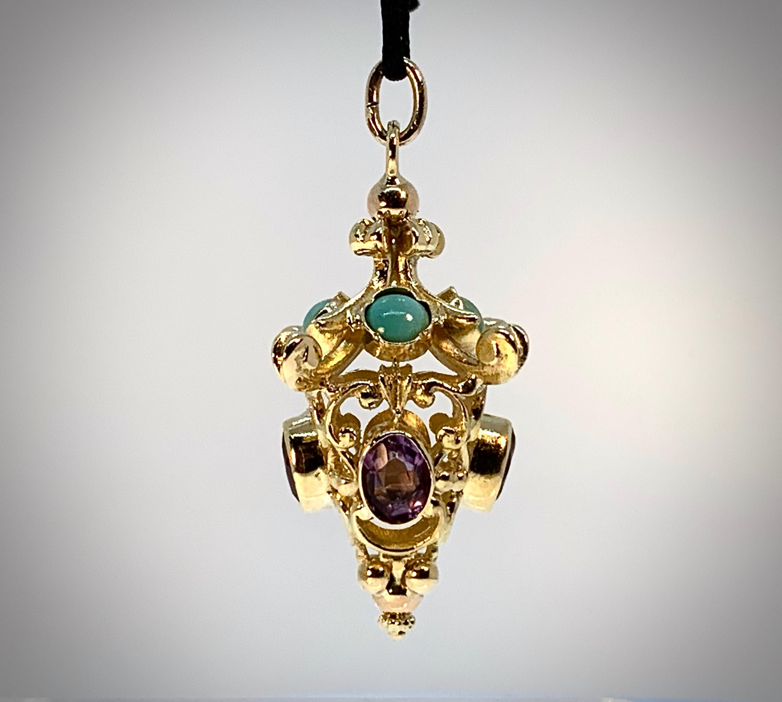 This pendant came to us with an oversized gondola charm, so our guess is that it's Italian and probably from the 1950's or 1960's -- during a sort of Etruscan Revival-Revival, when these ornate and heavy fobs, broadly characterized as