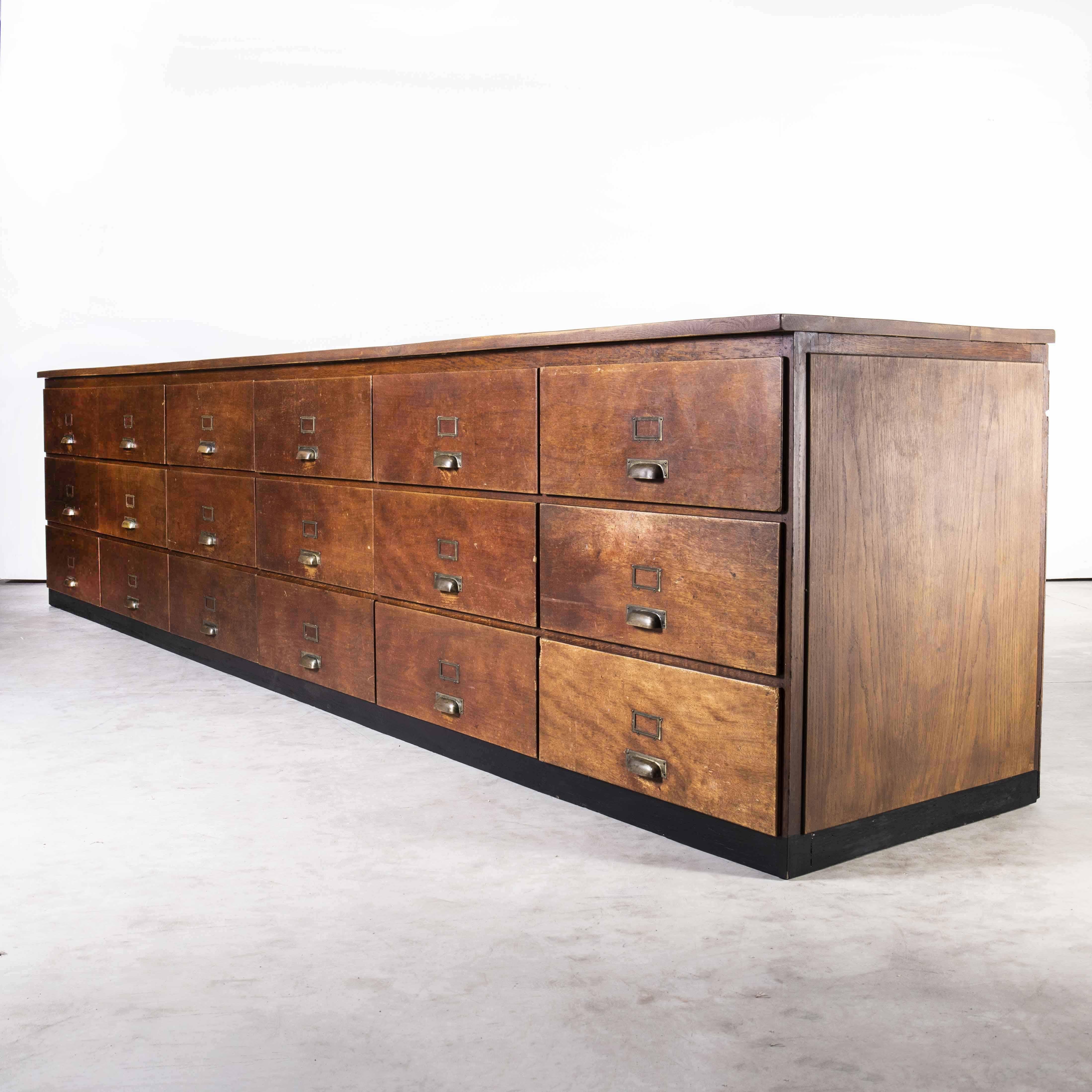 1950’s large Belgian Tailors shop counter – eighteen drawers
1950’s large Belgian Tailors shop counter – eighteen drawers. Very large Belgian shop counter from a tailors. The carcass frame is sold oak and unusually each end is panelled with oak