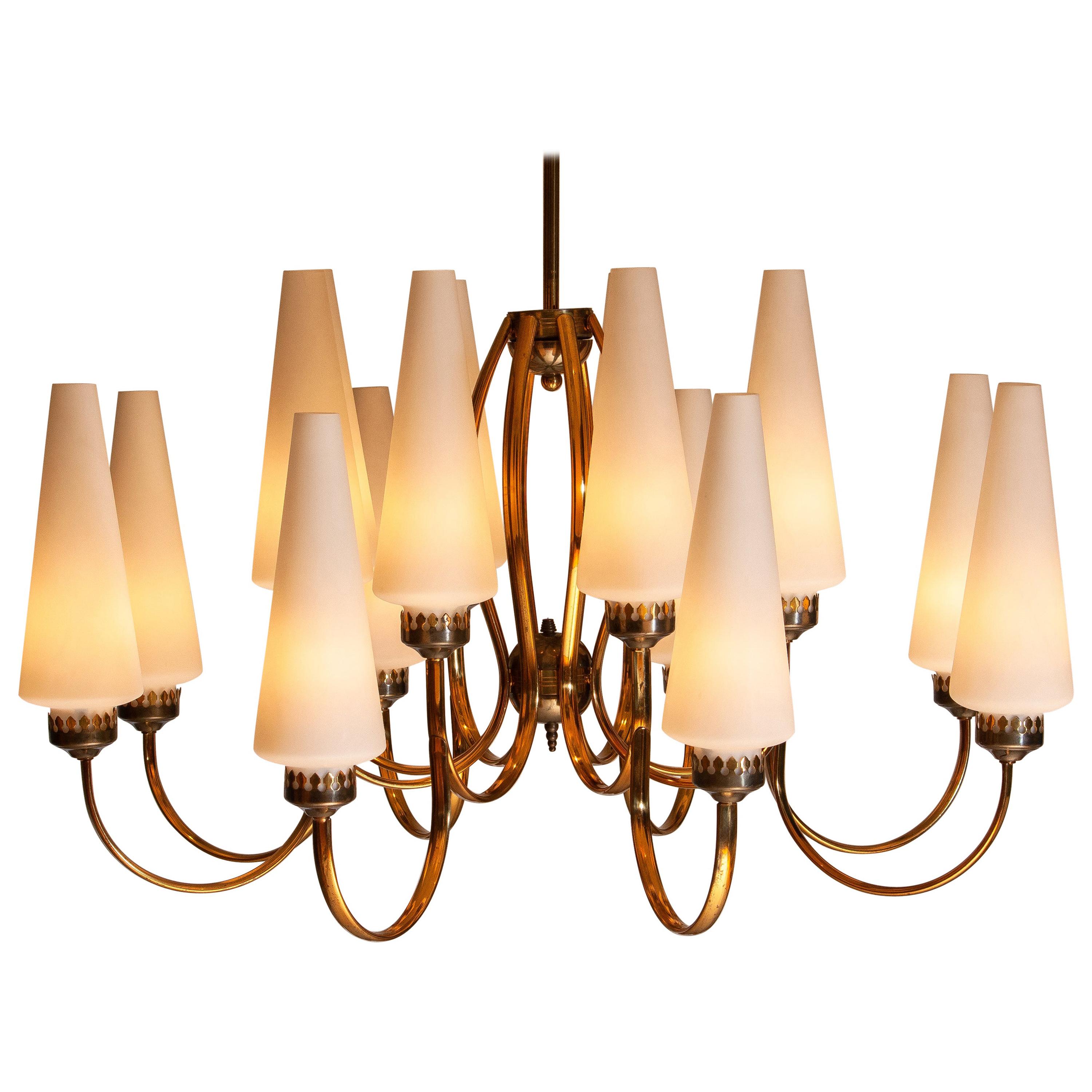 Exceptional big brass extra large chandelier with sixteen big Murano vases made by Stilnovo in the 1950s, Italy.
The diameter of these big chandelier is 90 cm or 36 inches.
The height of the Murano vases is 30 cm or 12 inches.
The total height is