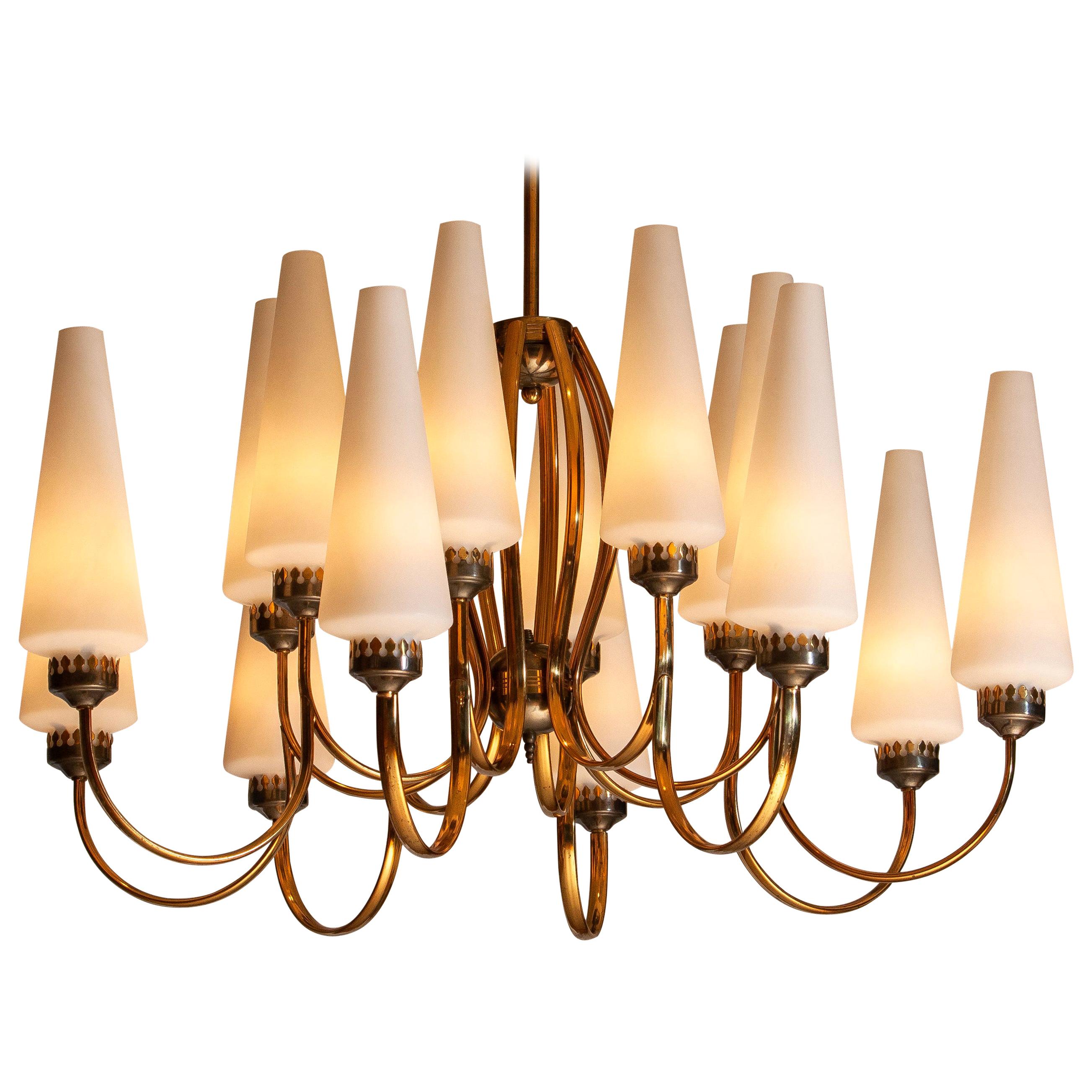 Exceptional big brass extra large chandelier with sixteen big Murano vases made by Stilnovo in the 1950s, Italy.
The diameter of these big chandelier is 90 cm or 36 inches.
The height of the Murano vases is 30 cm or 12 inches.
The total height is