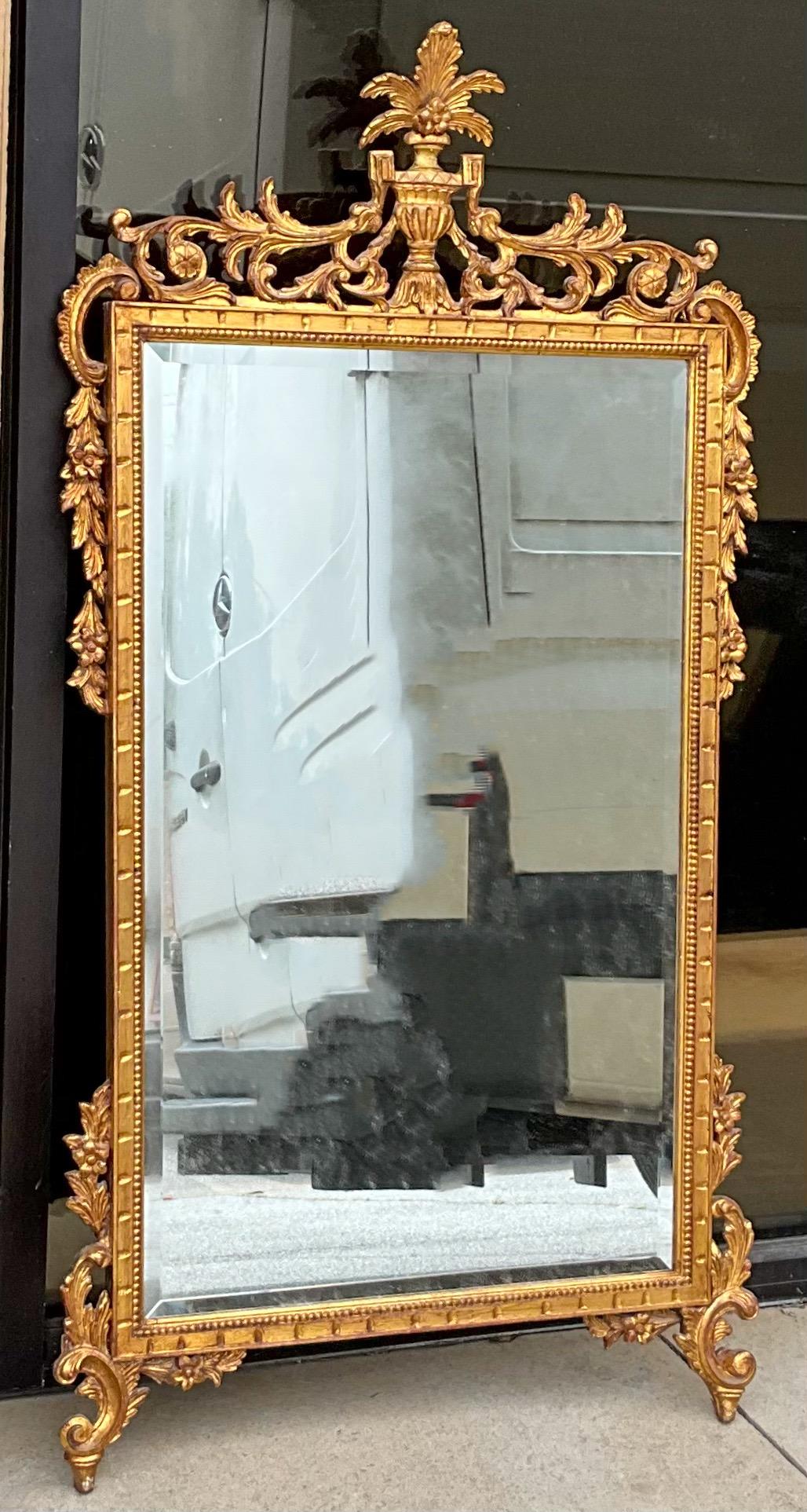 This is a lovely carved giltwood Chippendale style Italian mirror dating to approximately the 1950s . It is in very good condition, and it is unmarked.