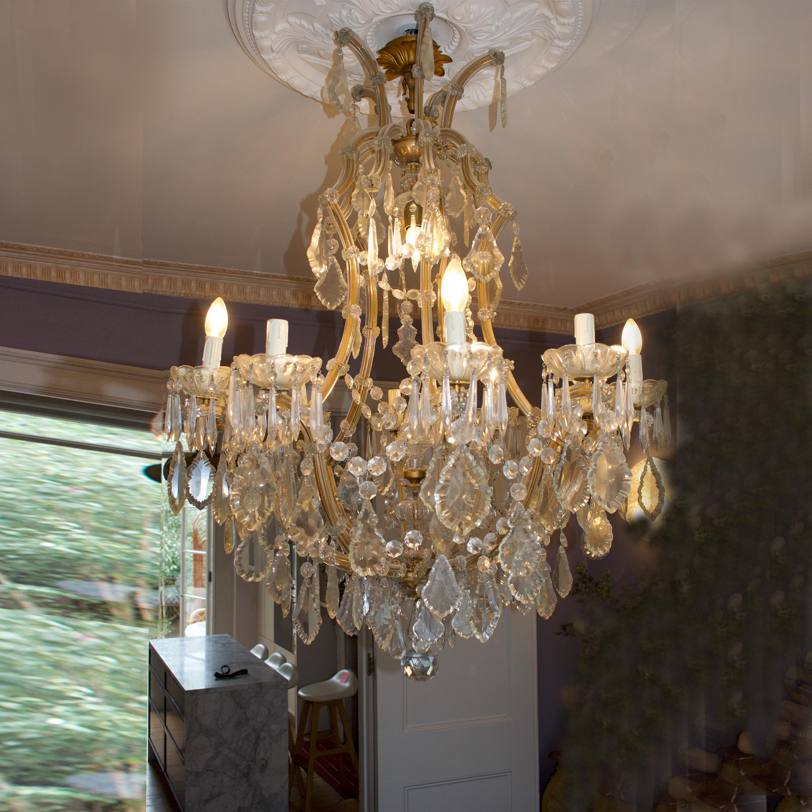 This stunning piece of artistry harks back to an era of sophistication and glamour, seamlessly blending the timeless design of the Marie-Thérèse chandelier with the chic sensibilities of 1950s France. Each tier is adorned with cascading crystal