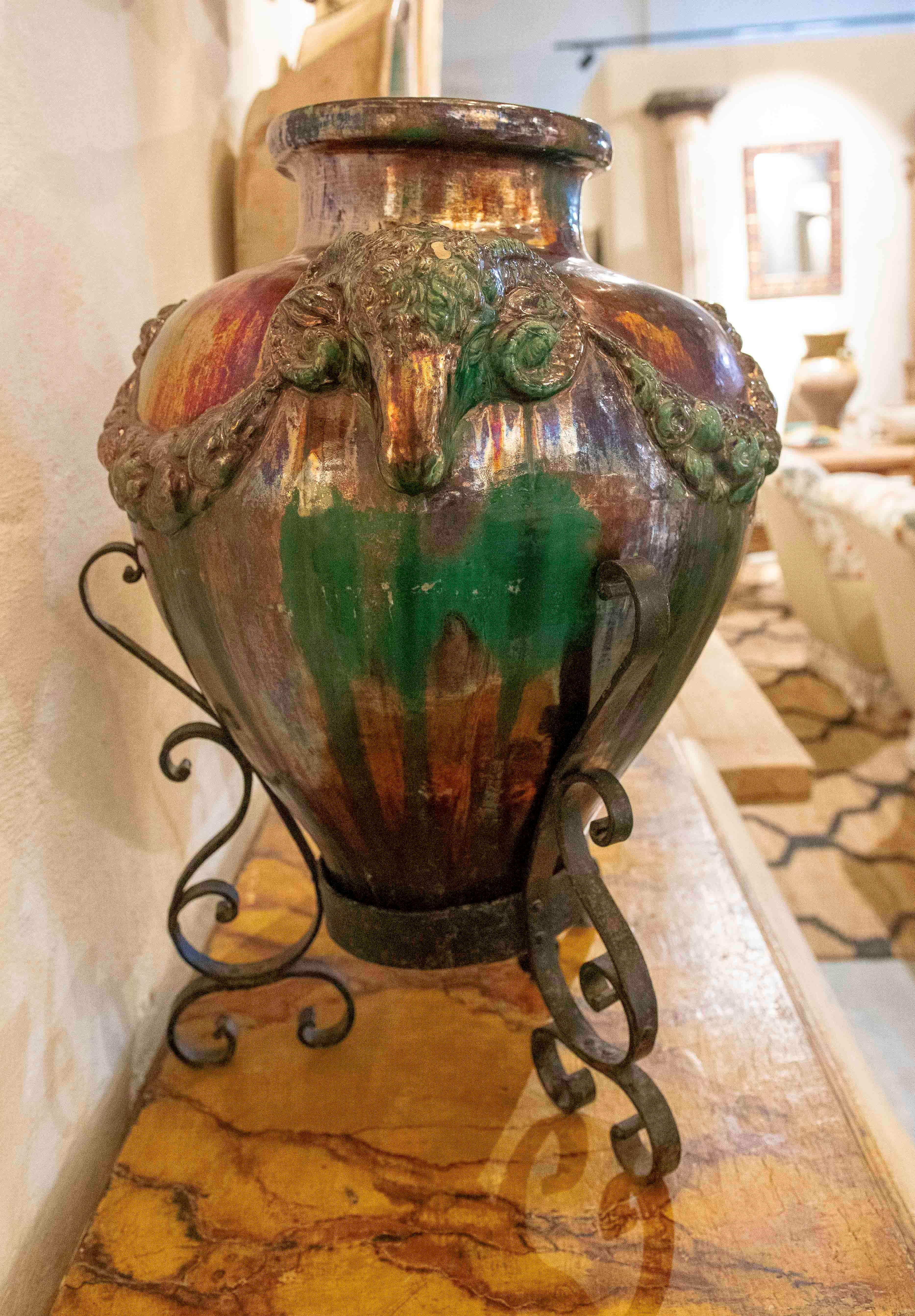 1950s Large Glazed Ceramic Vase with Ram Heads and Wrought Iron Base For Sale 6