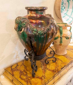 1950s Large Glazed Ceramic Vase with Ram Heads and Wrought Iron Base