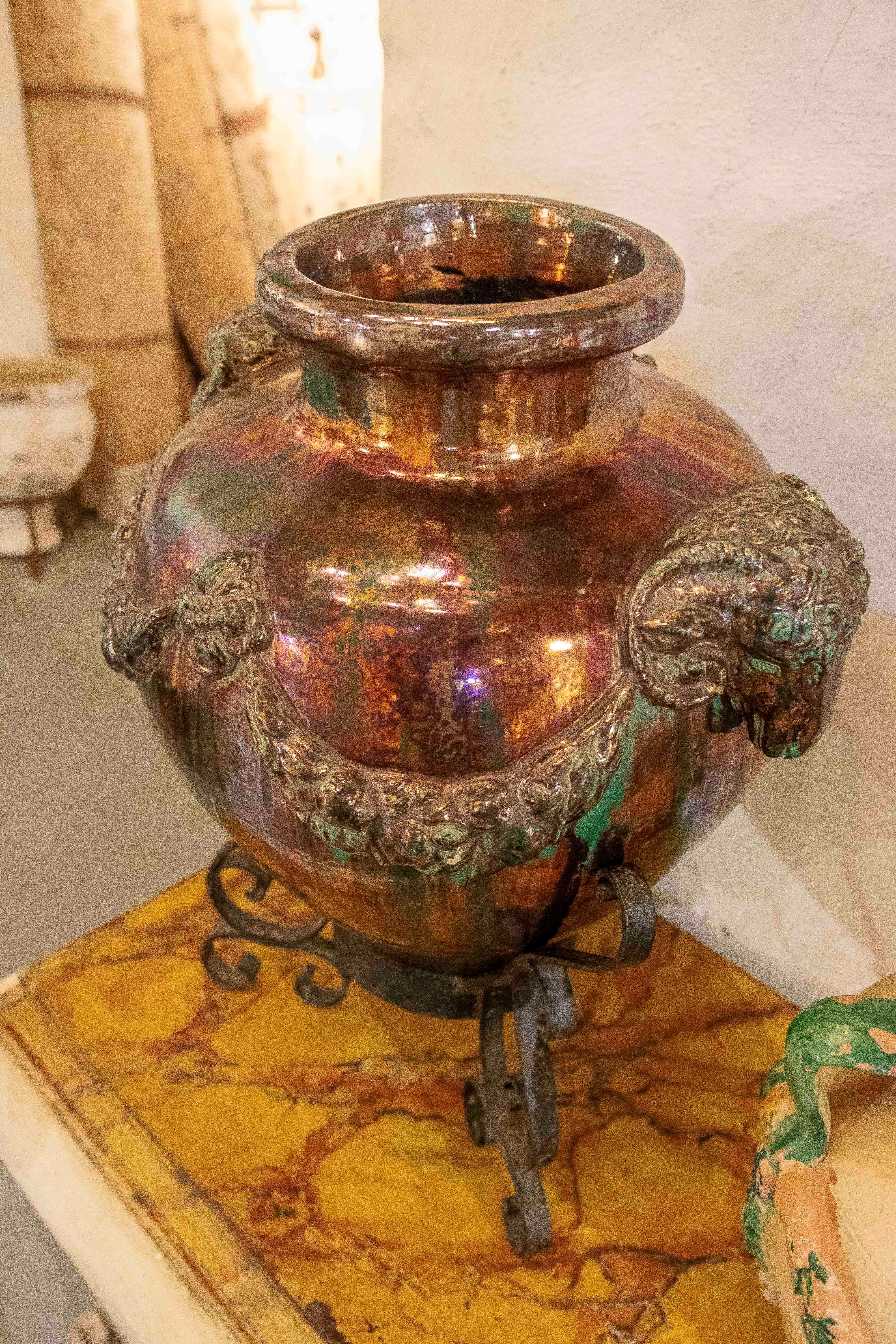 1950s Large Glazed Ceramic Vase with Ram Heads and Wrought Iron Base For Sale 1