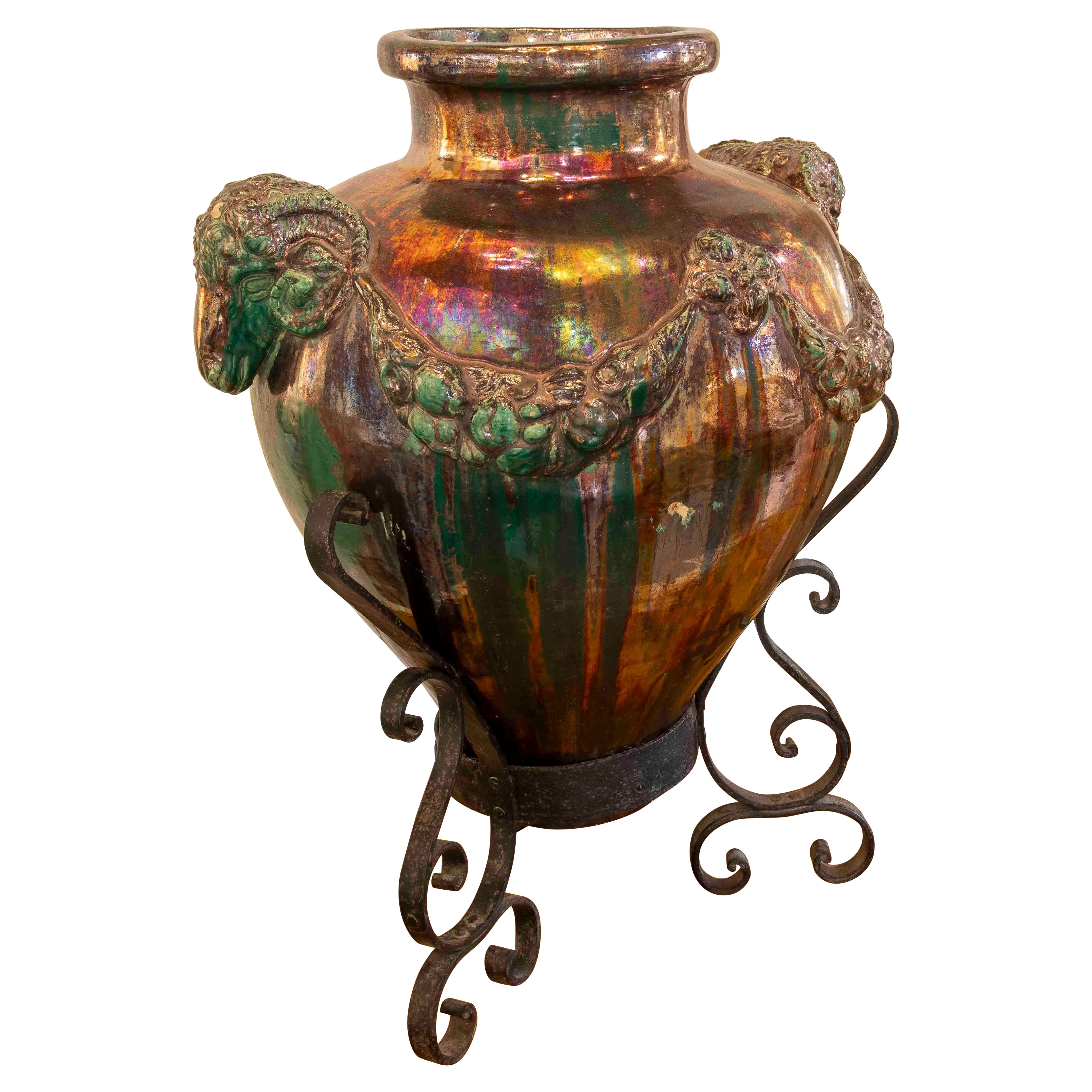 1950s Large Glazed Ceramic Vase with Ram Heads and Wrought Iron Base For Sale