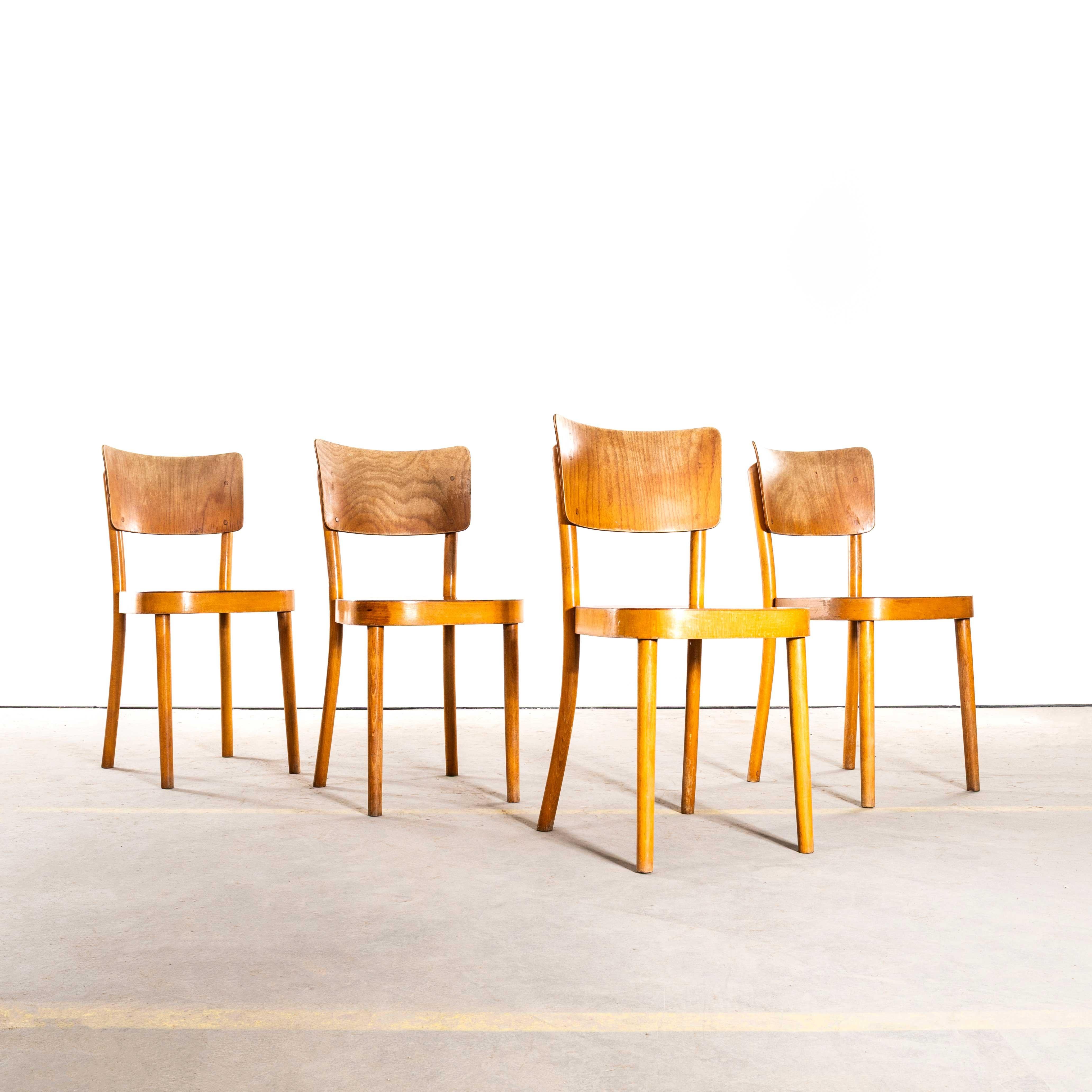 1950's Large Honey Oak Backed Dining Chairs With Thick Seats - Set Of Four. 
Produziert von der berühmten tschechischen Firma Ton, die auch heute noch tätig ist und schöne Stühle herstellt. Wir haben das Gestell behutsam restauriert, aber den