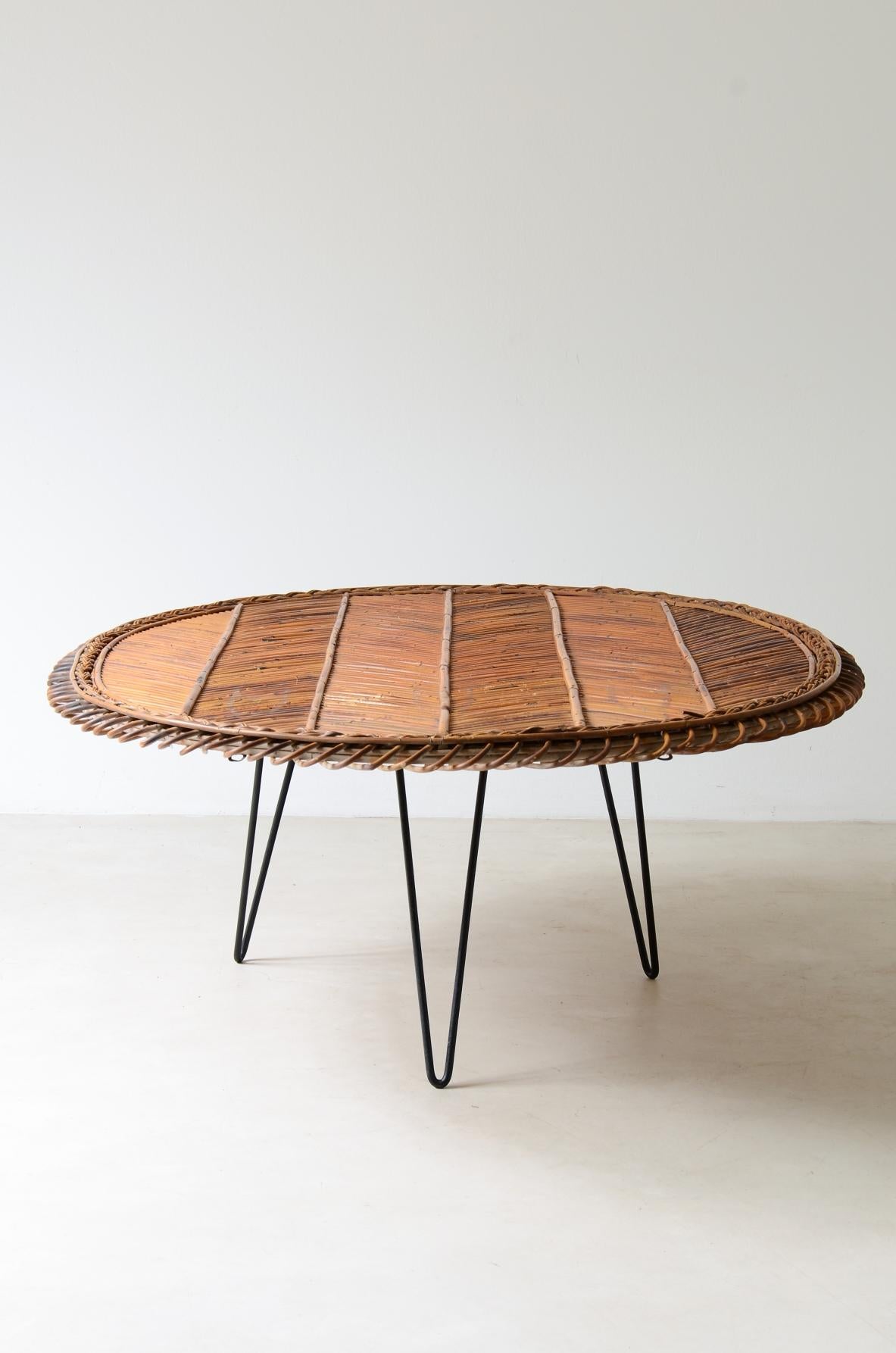 COD-2606
Large low table with herringbone rattan top and curved iron leg.

Italian manufacture, ca. 1950.

138x120xh48