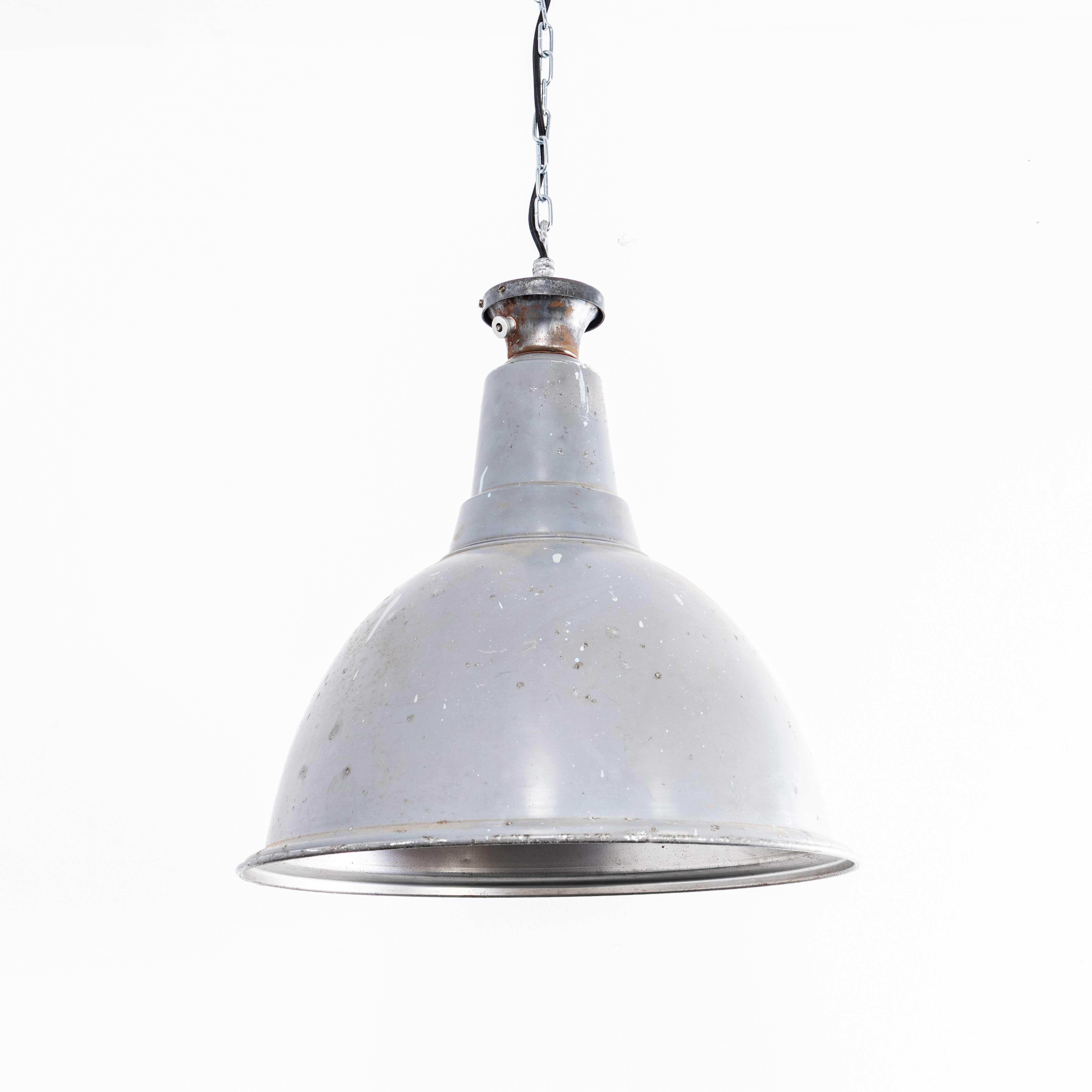 1950’s Large Scale Industrial Pendant Lamp – Grey Single. 

Sadly we don’t know the manufacturer, the lamp is made from spun and painted aluminium with intricate cast aluminium tops. The lamp has been cleaned, but we left the history of paint scars,