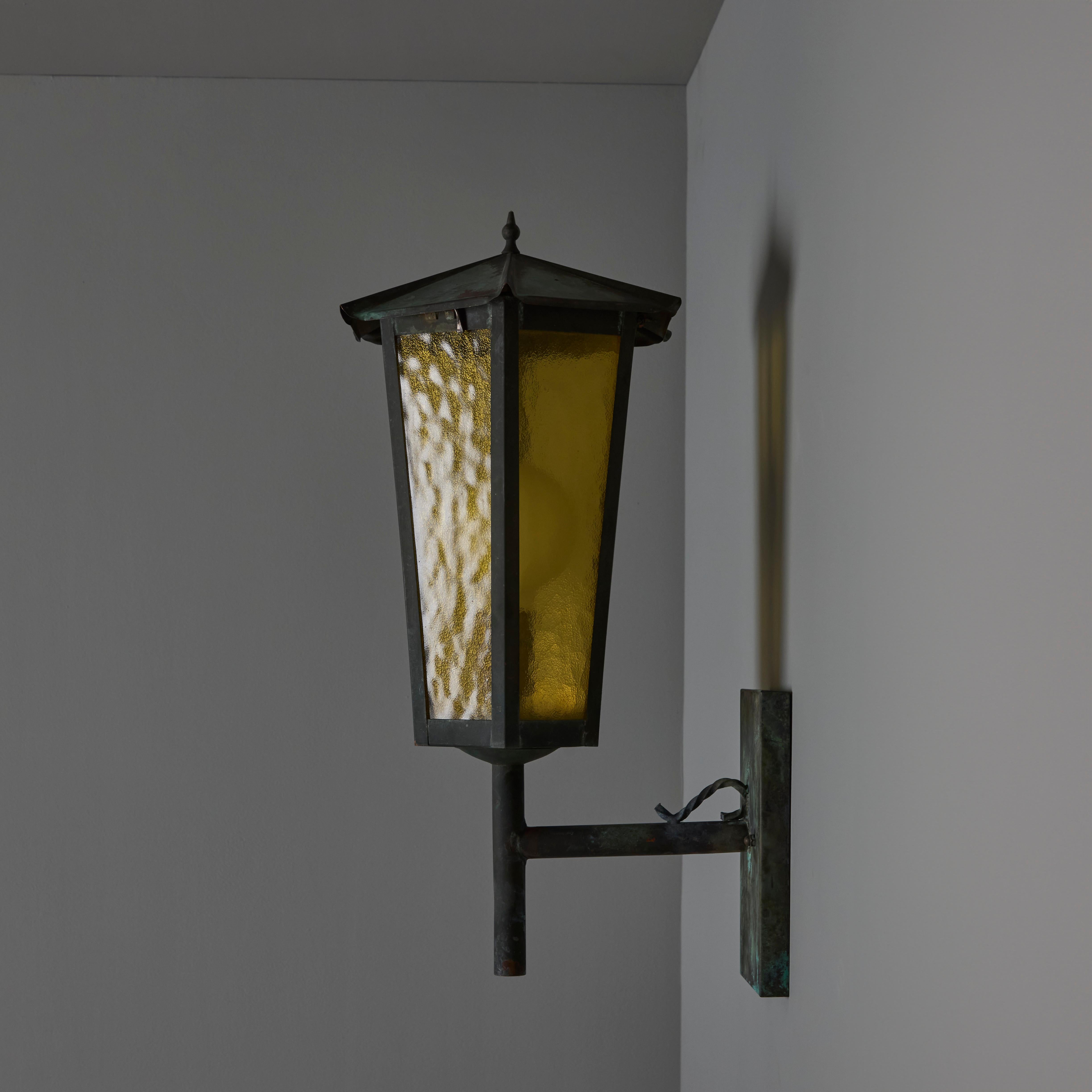 1950s Large Scandinavian Outdoor Wall Light in Patinated Copper and Amber Glass. Designer unknown. Executed in richly patinated copper and textured amber glass. A highly sculptural design, this outdoor or indoor wall light exudes Scandinavian