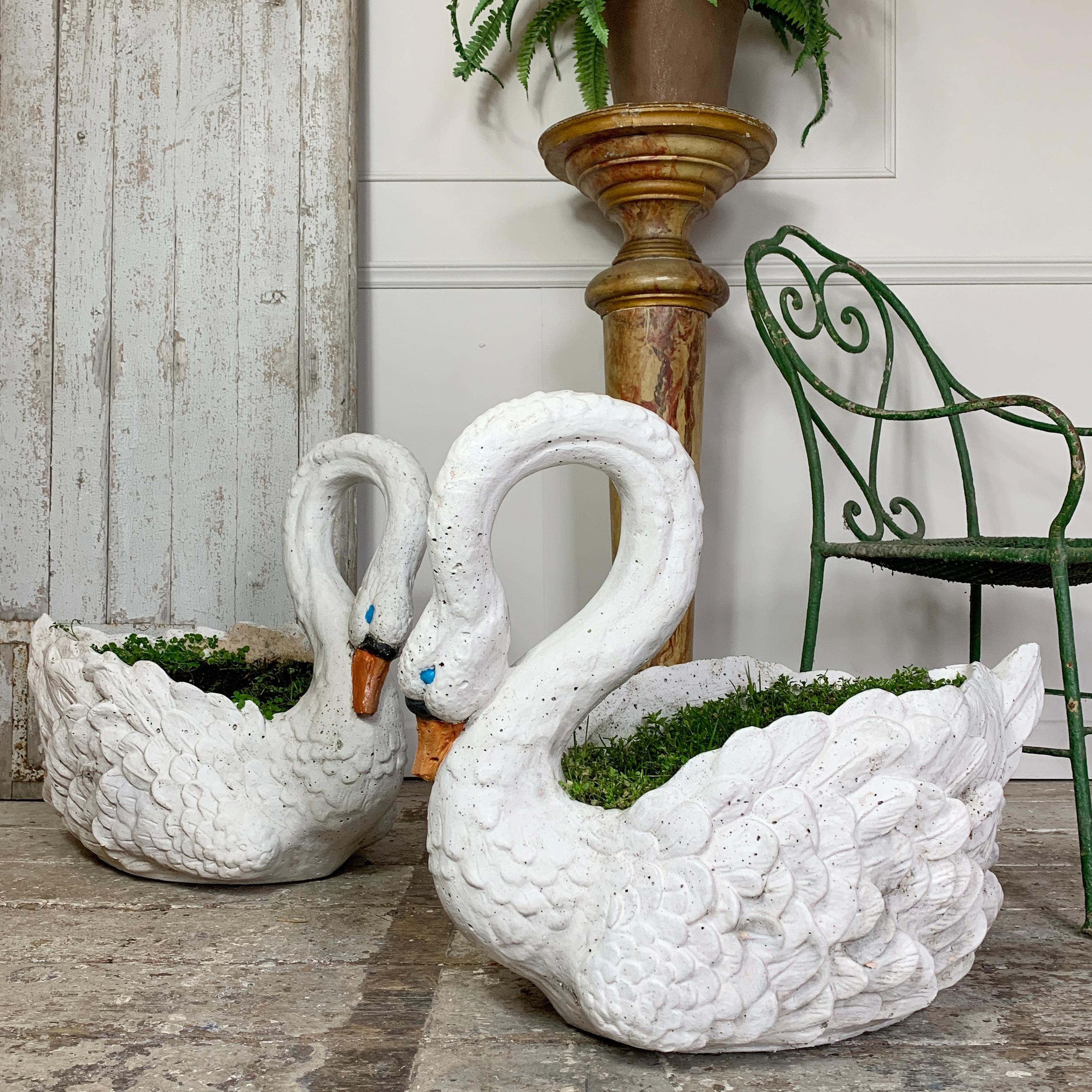 A rare matching pair of 1950s French life-size swan planters
In great condition, with wear commensurate with their age
Historical paint

Extremely heavy pieces approximate 65kg each

Rare and high quality, well made pieces
Measures: 71cm