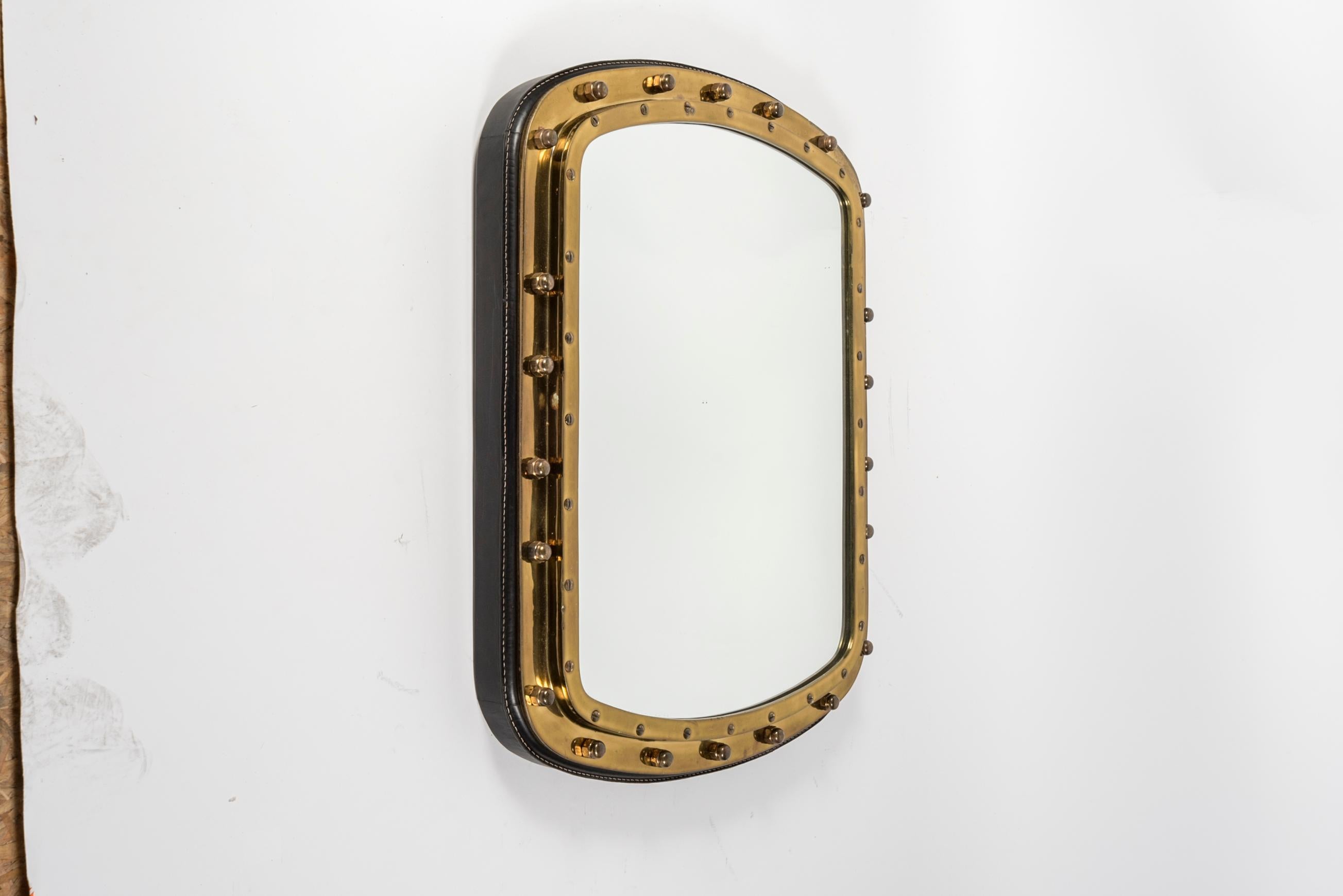 French 1950s Large wall mirror in stitched leather and bronze by Jacques Adnet