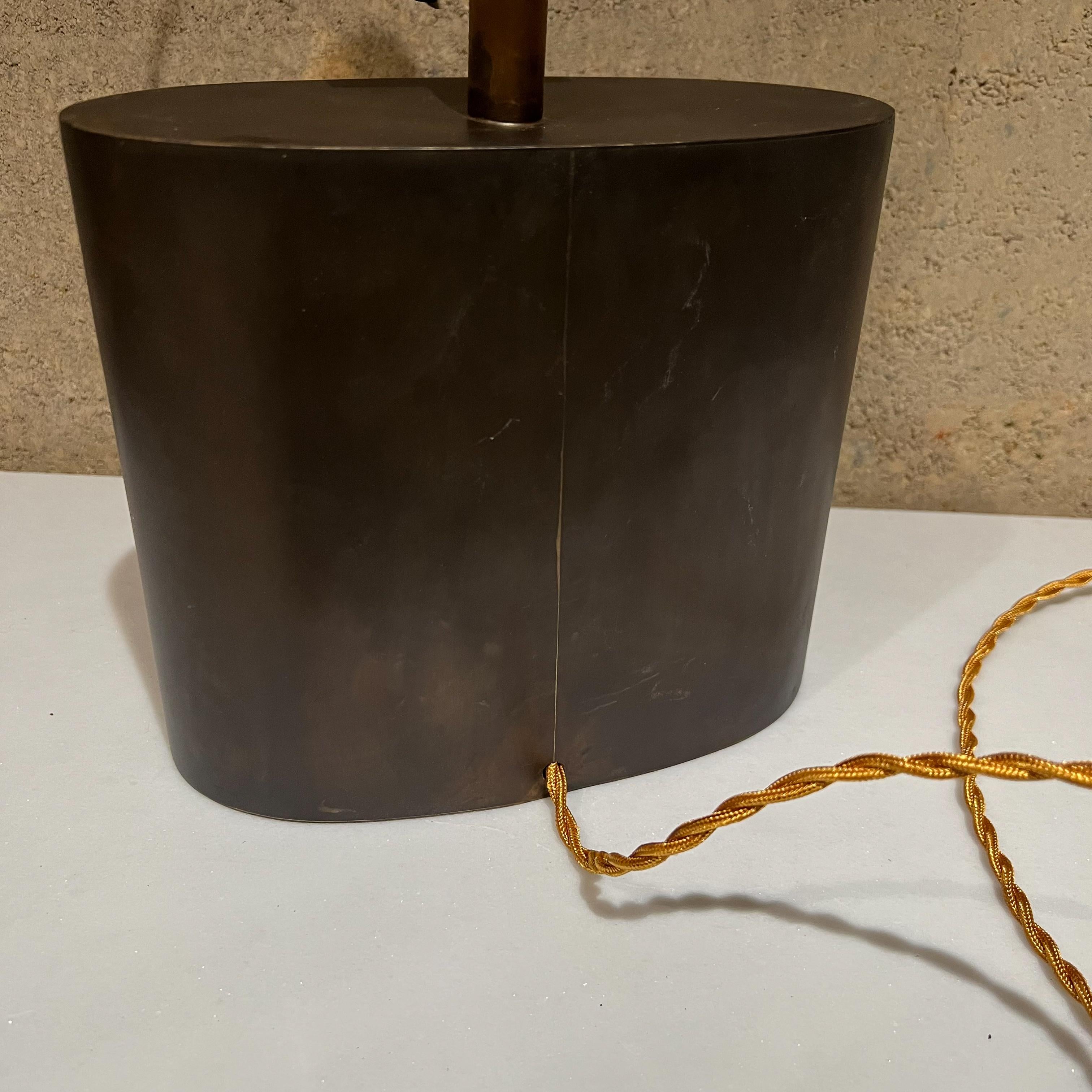 Table lamp
1950s Laris refined modern table lamp brass and copper elegant simplicity
Stamp appears as Laris
Decorative center brass plate
Measures: Socket 13.75 tall x 22 to top of finial 8.5 W x 4.25 D
Preowned vintage condition with new silk