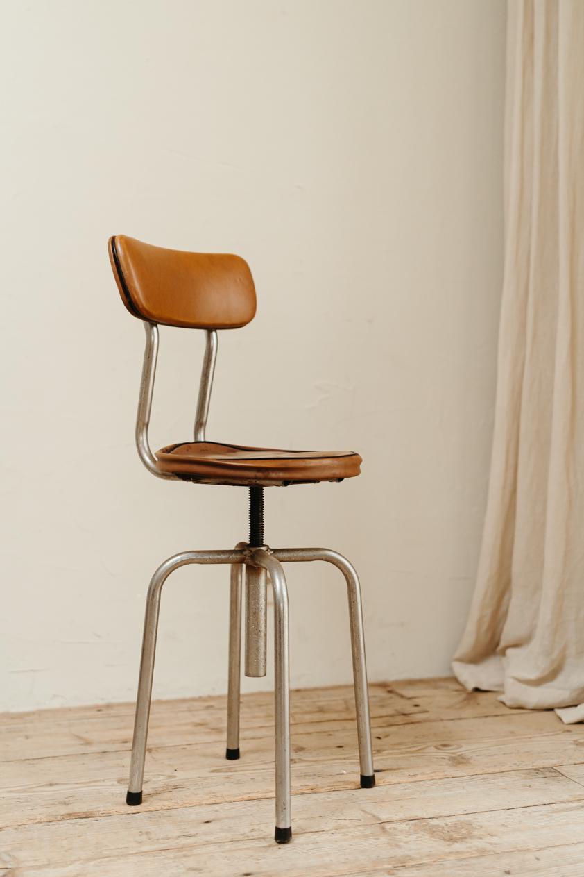 A 1950s chrome and leather stool, lovely patina, sturdy and ready to use.