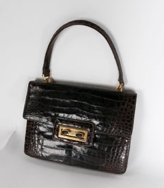 Sac en cuir avec décorations et fermoir en métal doré, années 1950