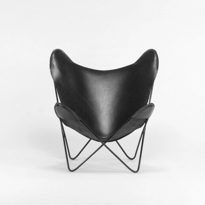 Listed for sale is a gorgeous C. 1950 vintage black leather Butterfly chair, designed by Jorge Ferrari Hardoy, Antonio Bonet, and Juan Kurchan for Knoll. This is a vintage example, which came from a Philadelphia estate along with a number of other