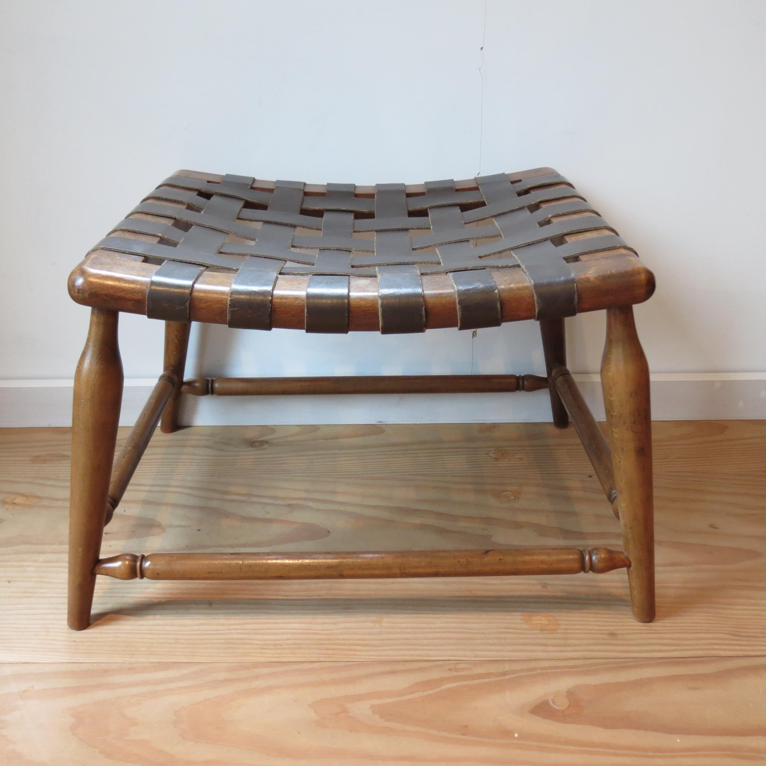 Wonderful wooden stool with leather strap seat, dates from the 1950s. Made from solid beech with brown leather strap seat. In good vintage condition. Some wear and patination to the leather seat.
ST1274.