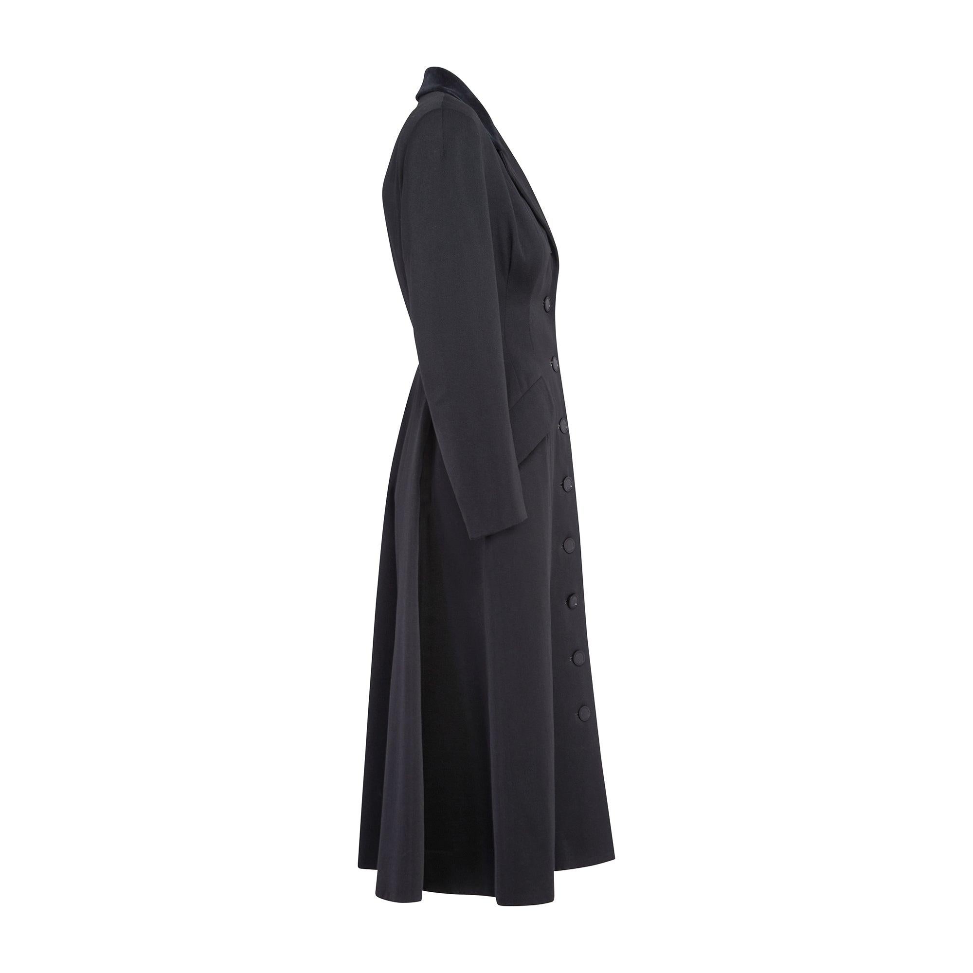This 1950s structured wool riding coat was made by British ready to wear designer Leslie Raymond. It was retailed in the famous Harrogate department store, Cresta, a regional branch of Marshall and Snelgrove of London. The V&A has a very similar