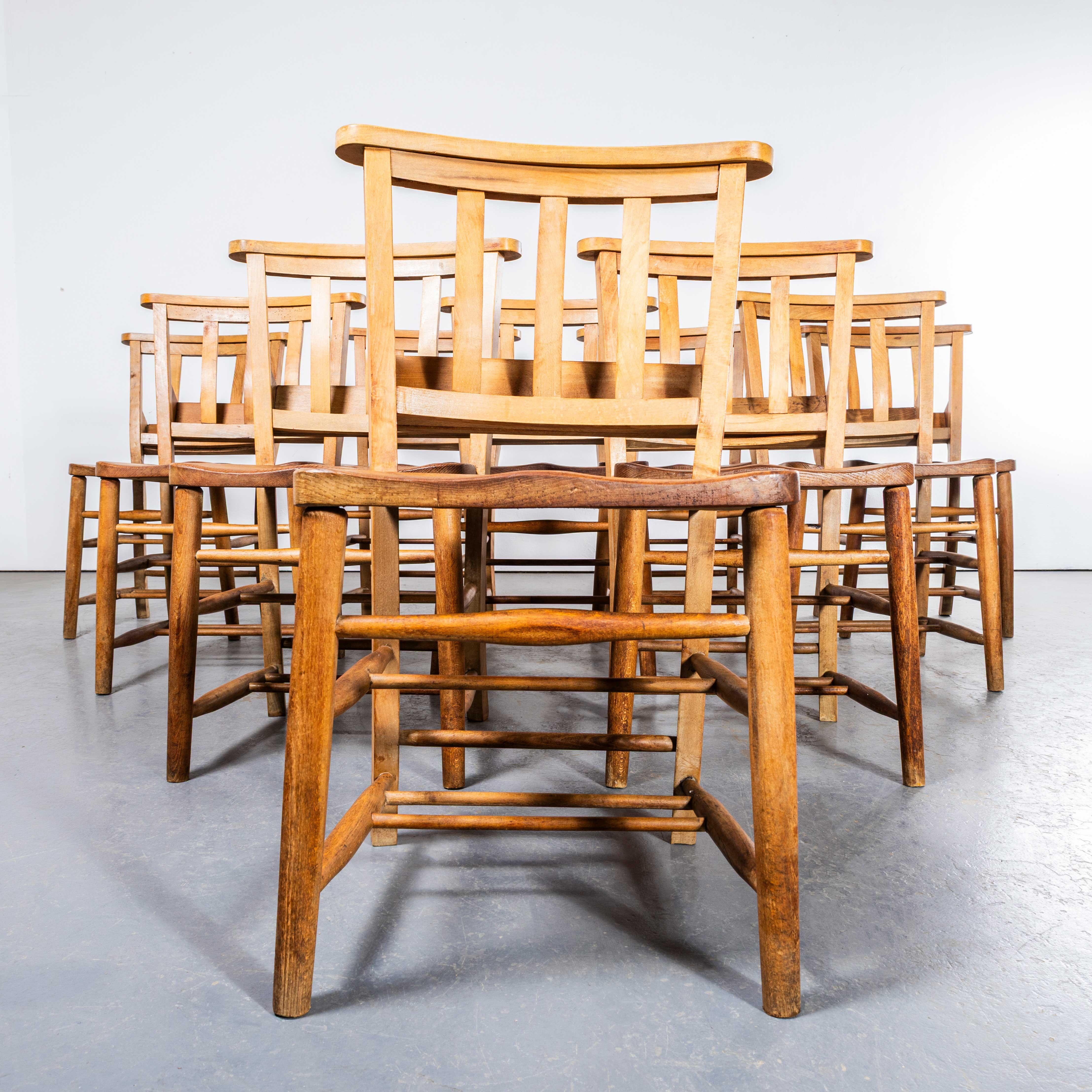 1950’s Light English Slatted Back Church Dining Chairs – Set Of Ten. 

England has a wonderfully rich heritage for making chairs. At the height of production at the turn of the last century over 45000 chairs were being produced daily in the villages